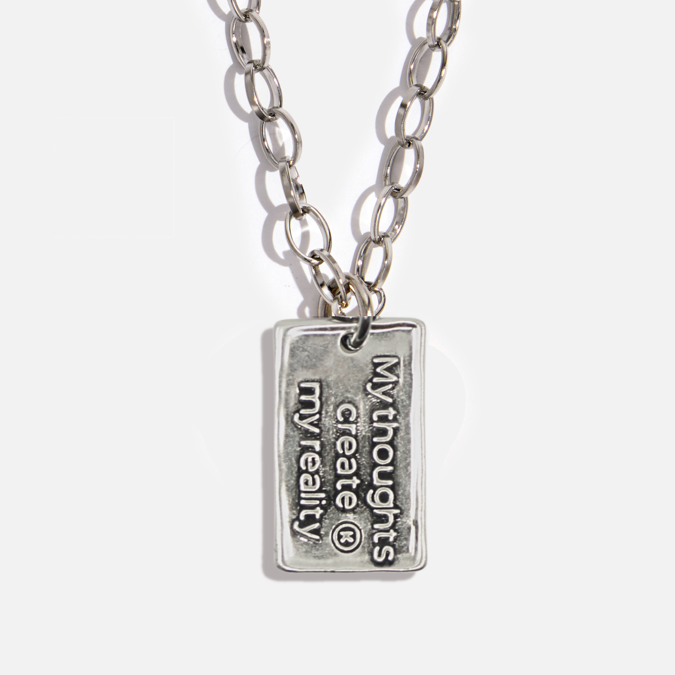 Silver necklace with a pendant on a white background