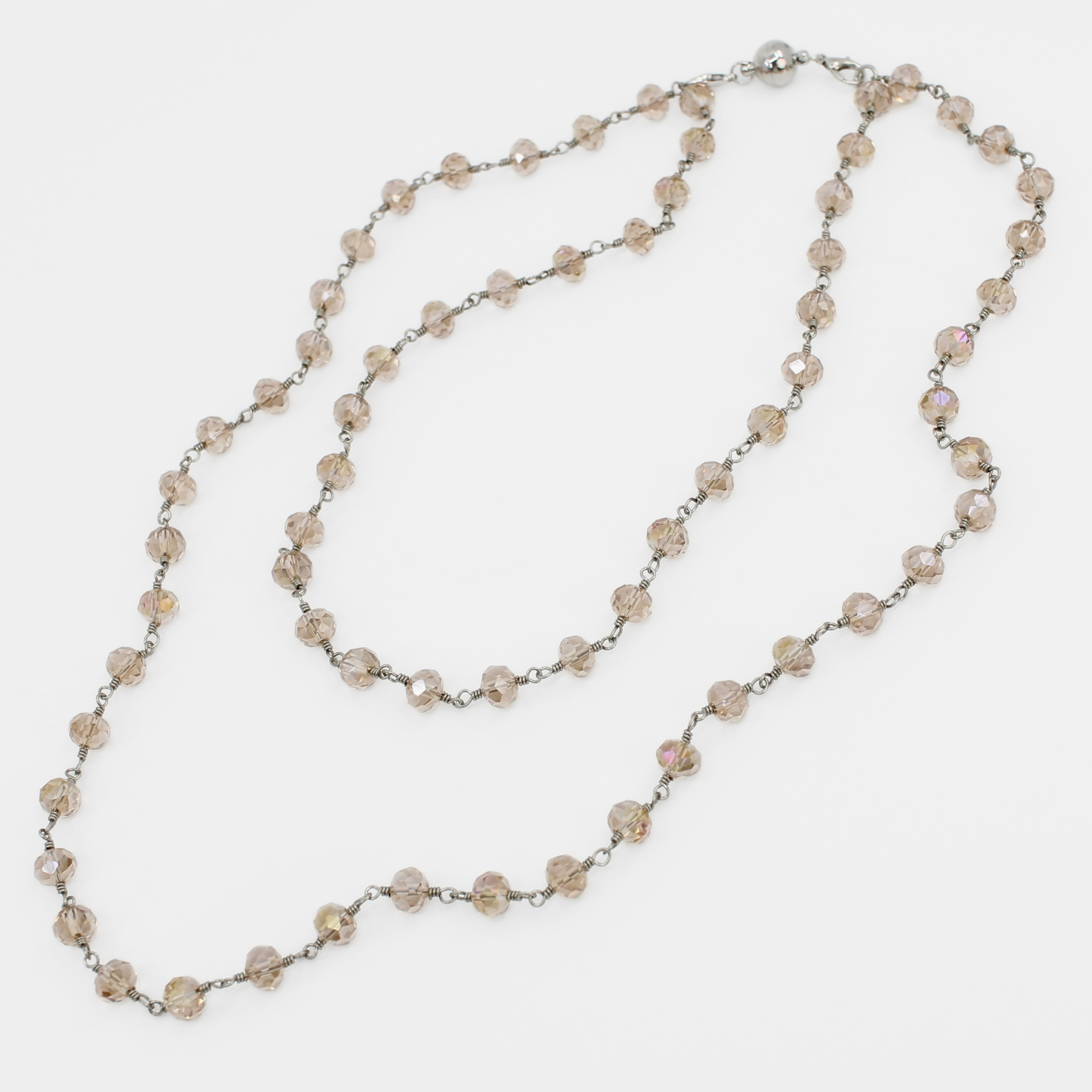 Long beaded necklace on a white background