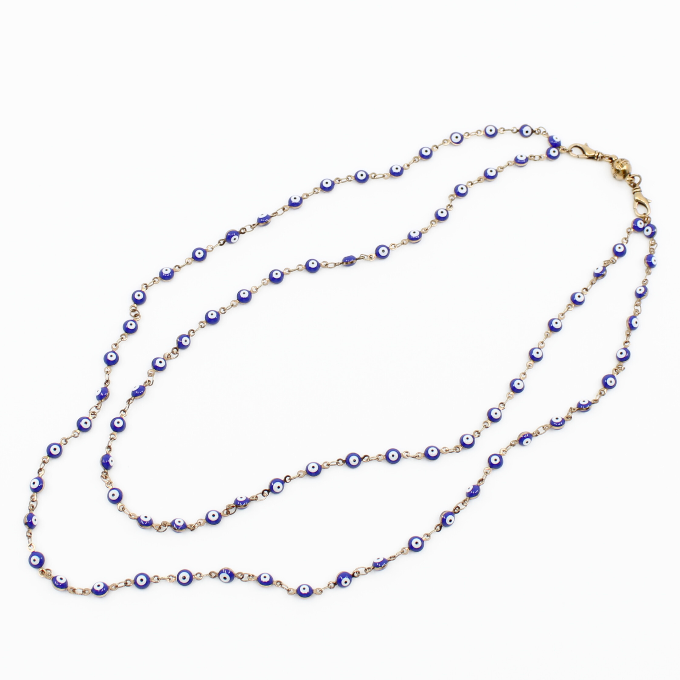 Necklace with blue and gold beads on a white background
