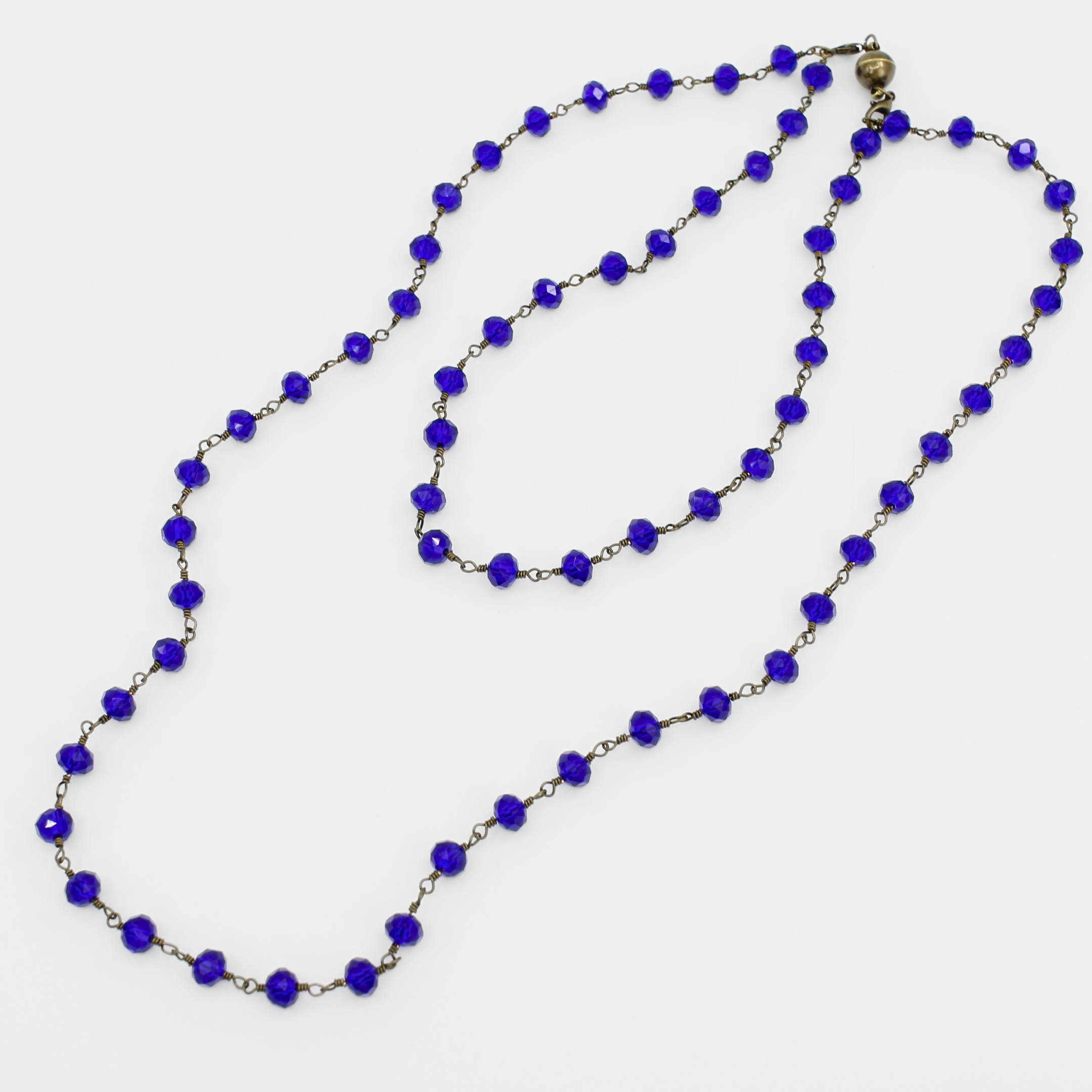 Necklace with blue beads on a white background