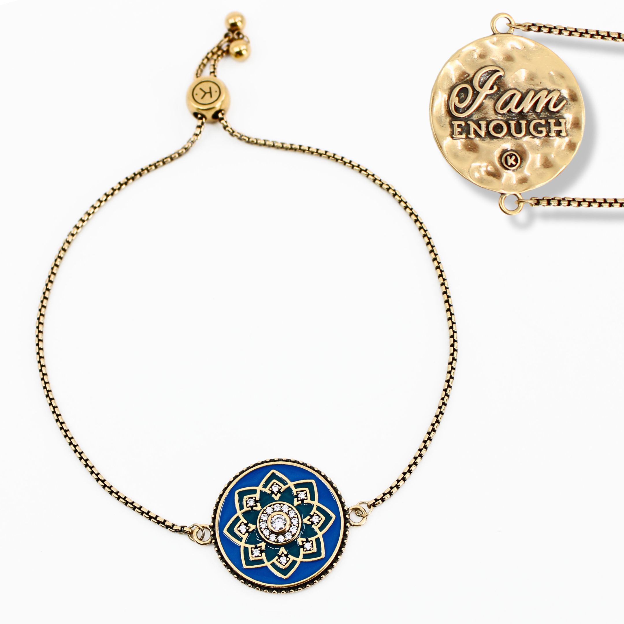 Gold bracelet with blue mandala charm and 'I am enough' pendant on a white background