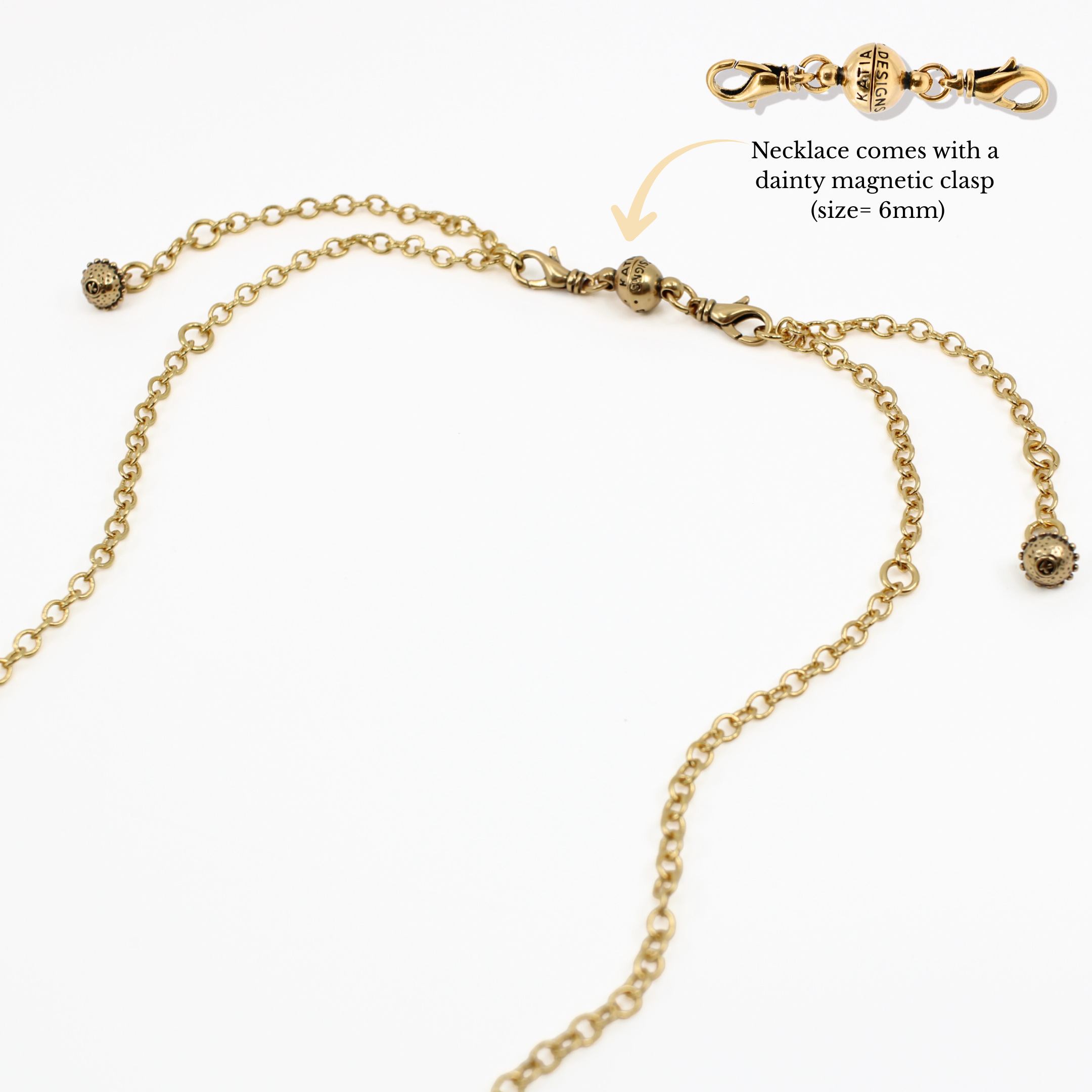 Gold necklace with magnetic clasp on a white background