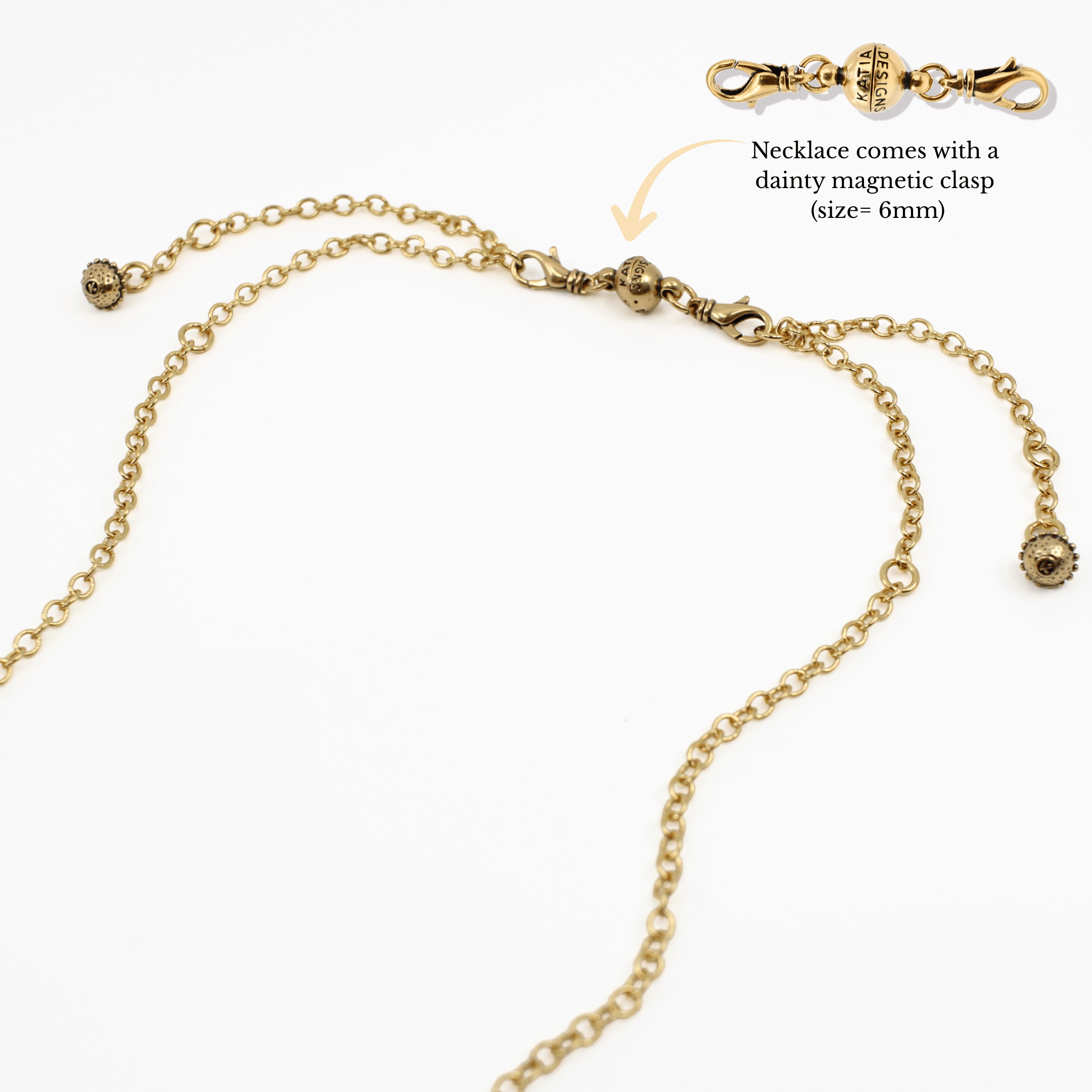 Gold necklace with magnetic clasp on a white background