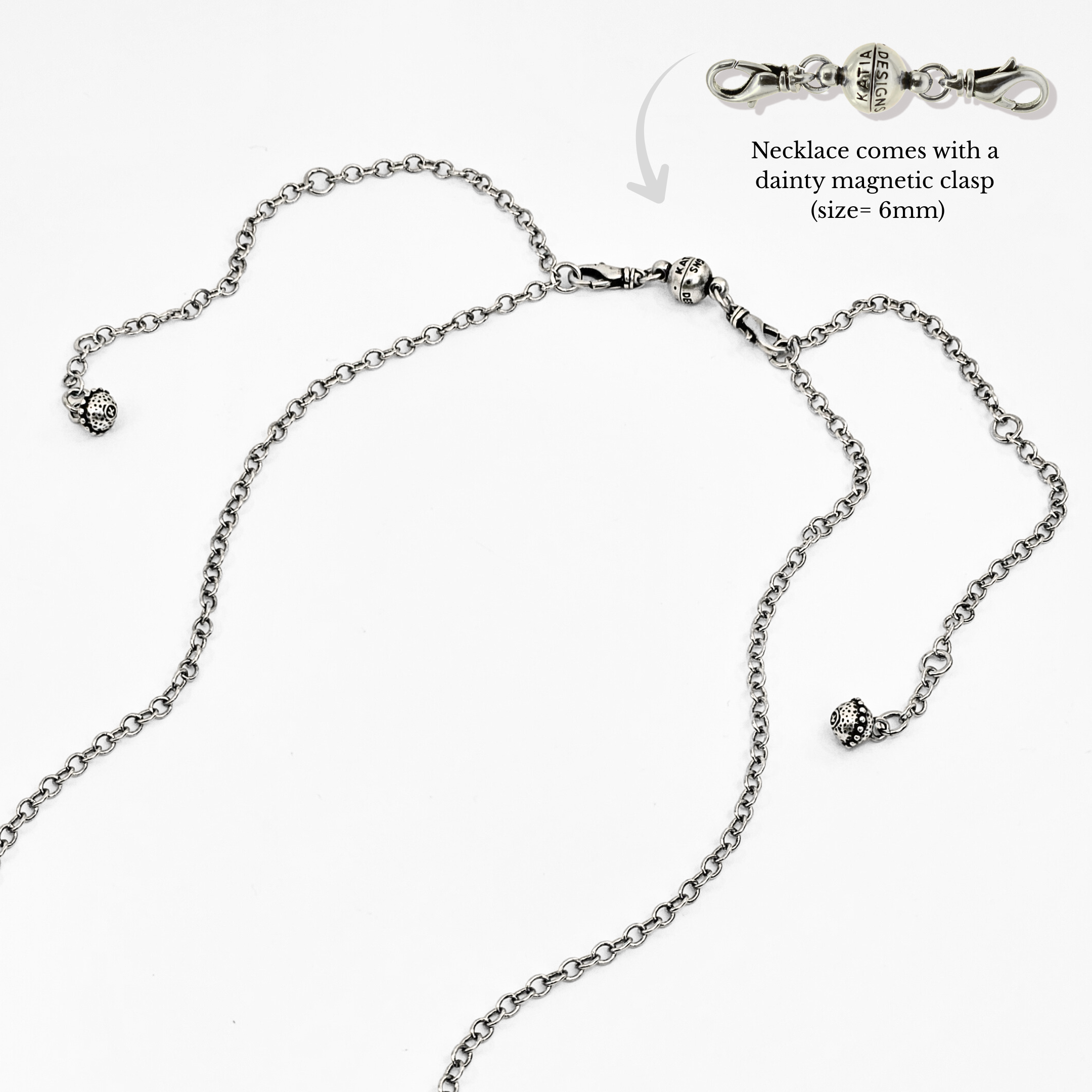 Silver necklace with a dainty magnetic clasp on a white background