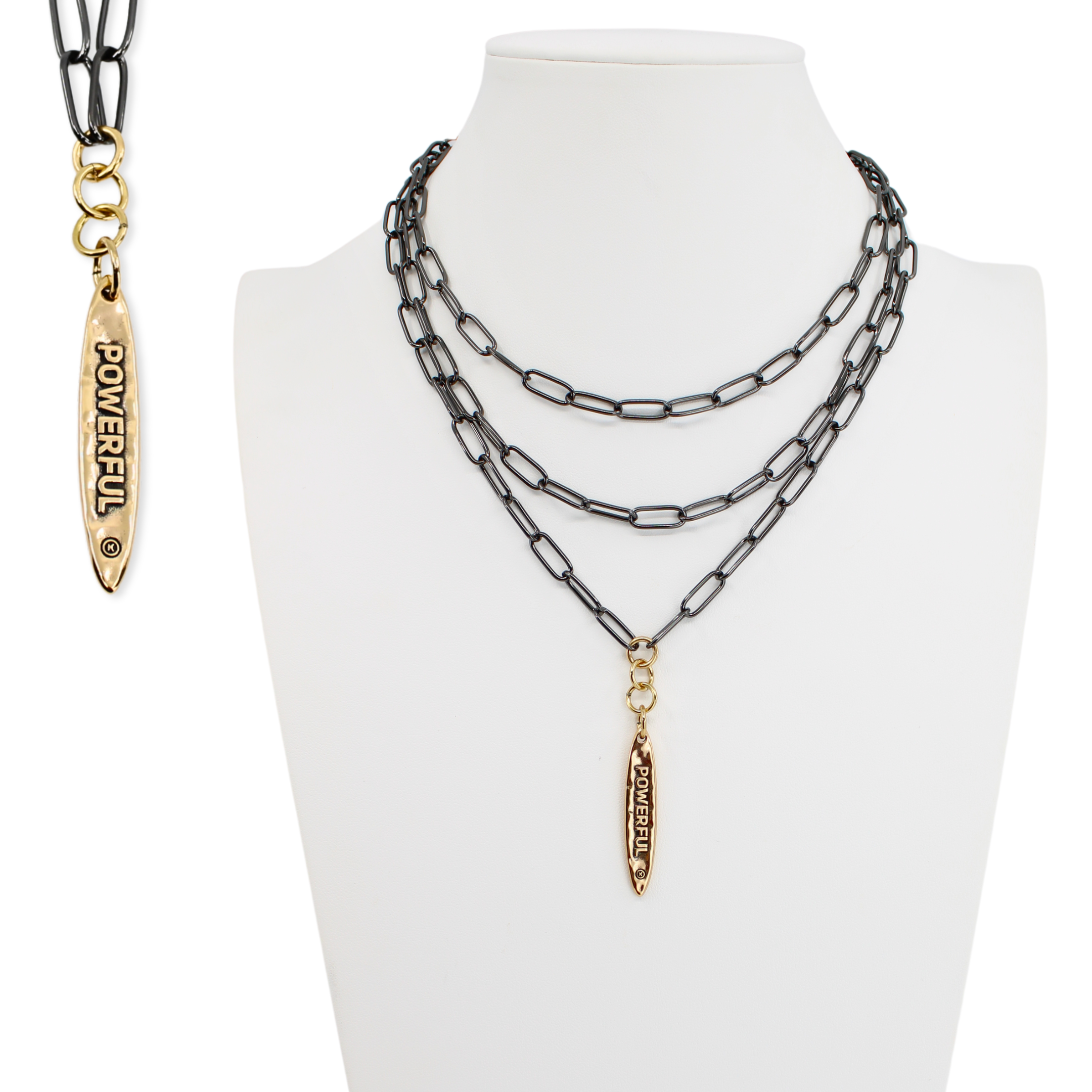 Necklace with gold pendant on a mannequin bust against a white background