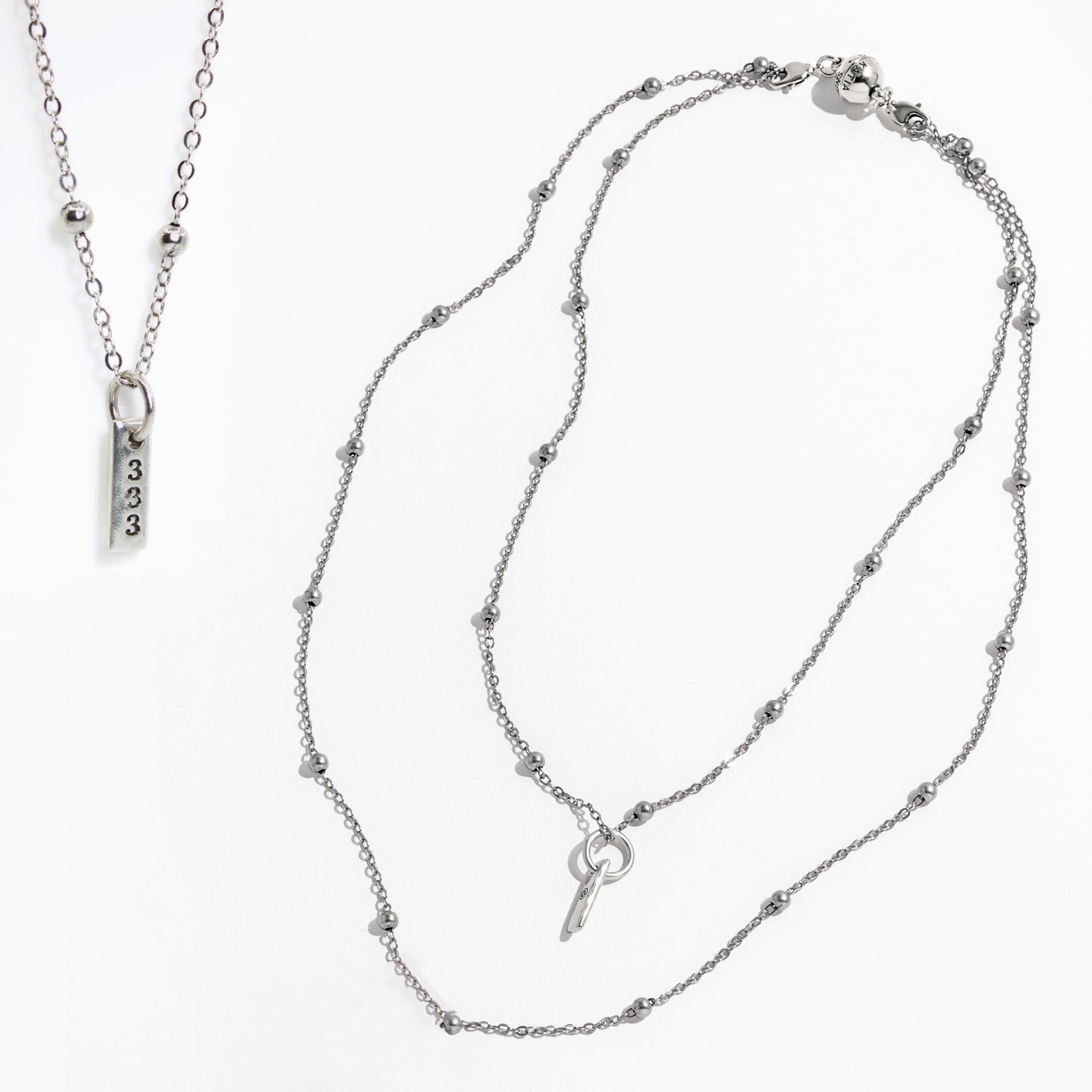Two silver necklaces on a white background