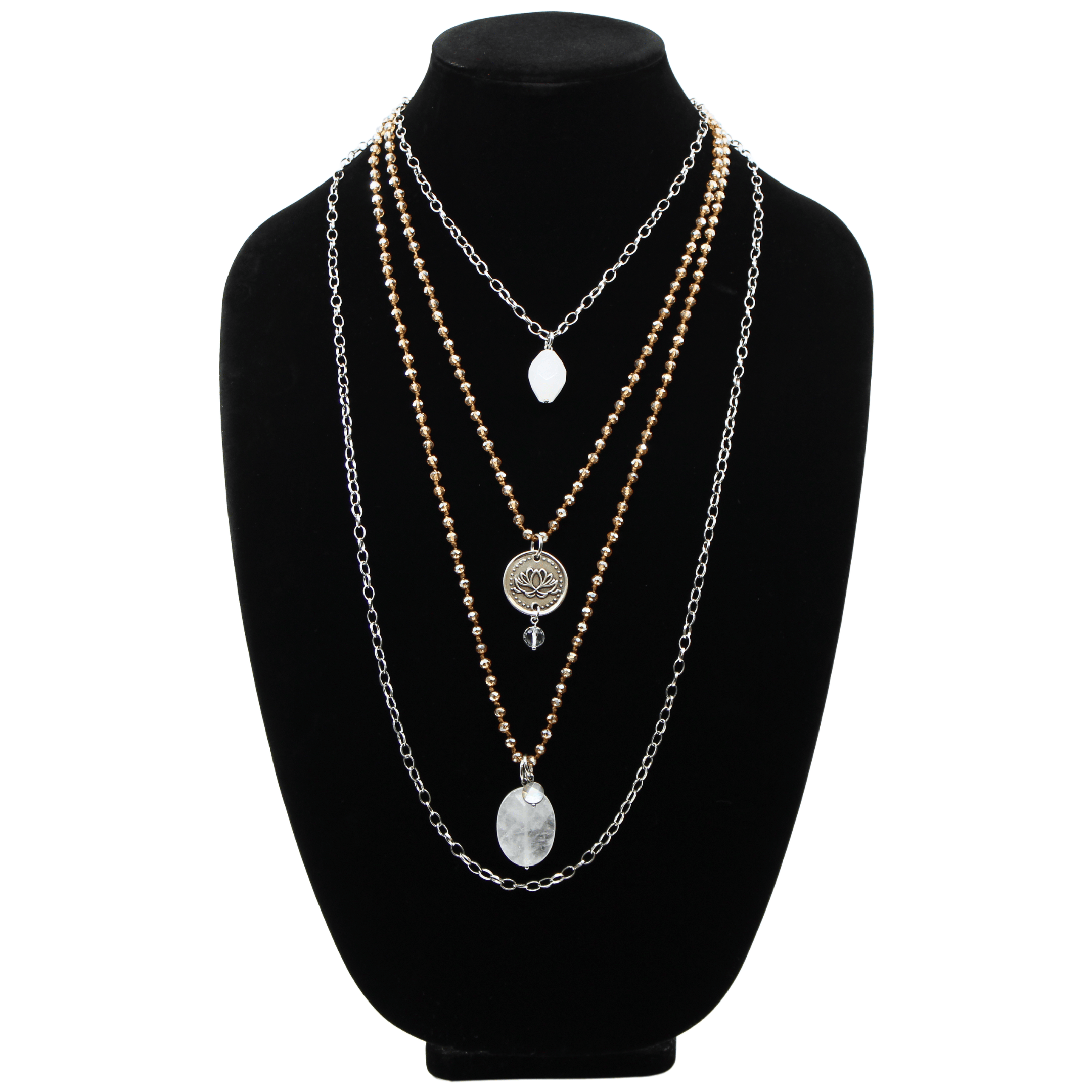 A collection of layered necklaces with various beads and clasps, featuring gold and silver finishes, with one necklace having a pendant that reads 'Remember who the f*** you are'.
