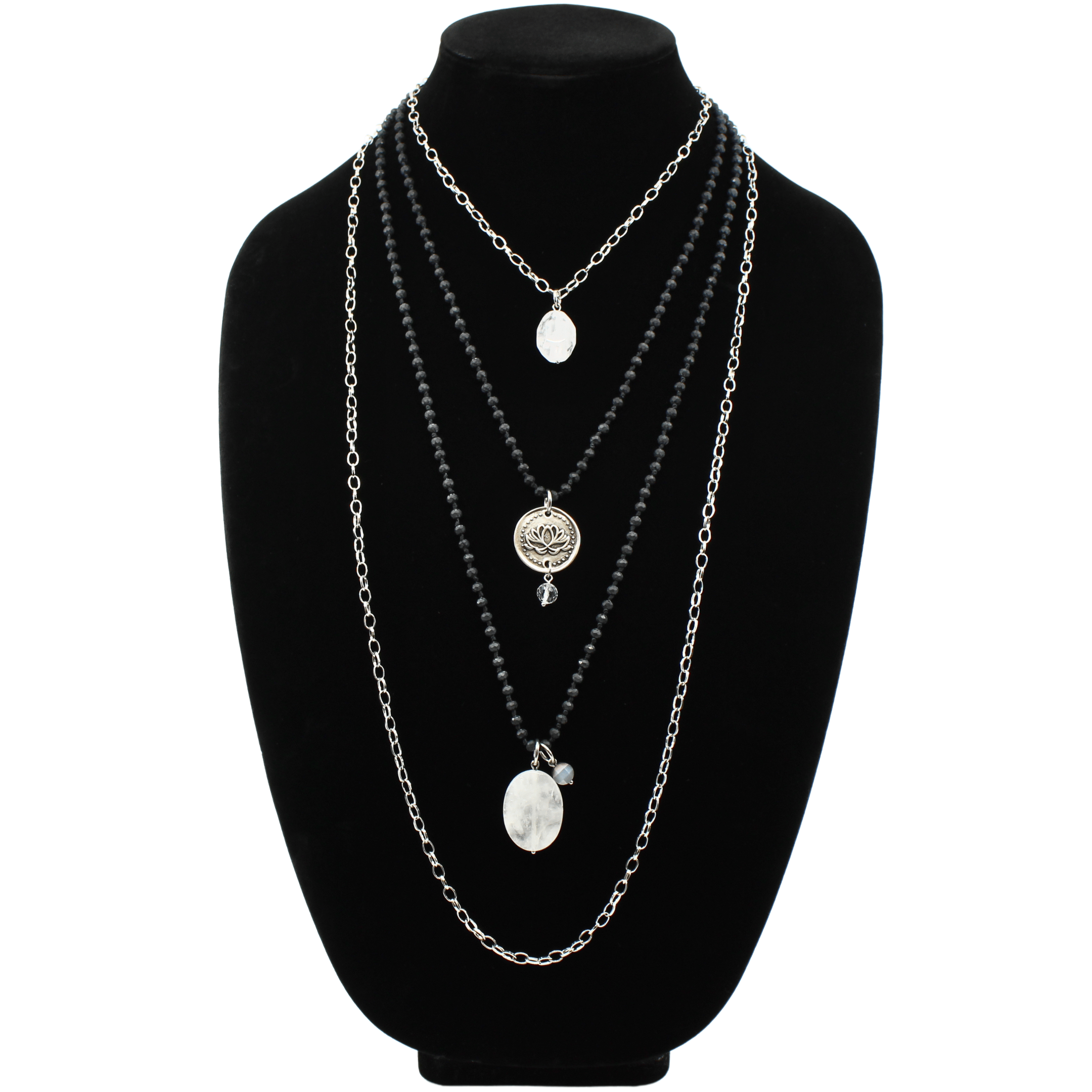 A collection of layered necklaces with various beads and clasps, featuring gold and silver finishes, with one necklace having a pendant that reads 'Remember who the f*** you are'.