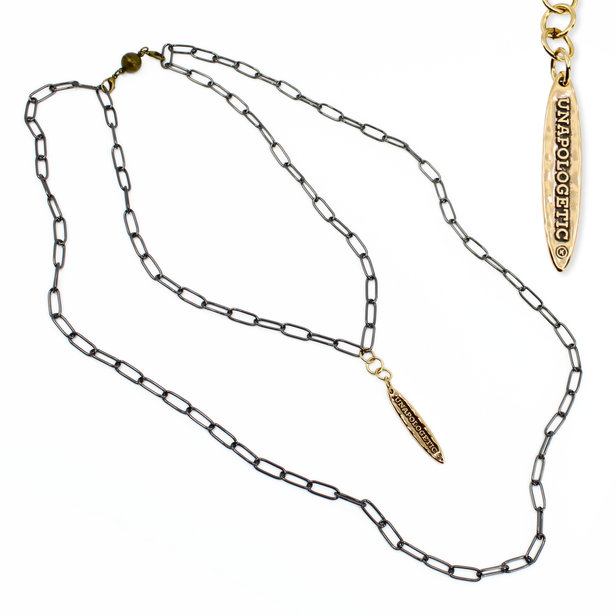 Gold and silver chain necklace with branded pendants on a white background