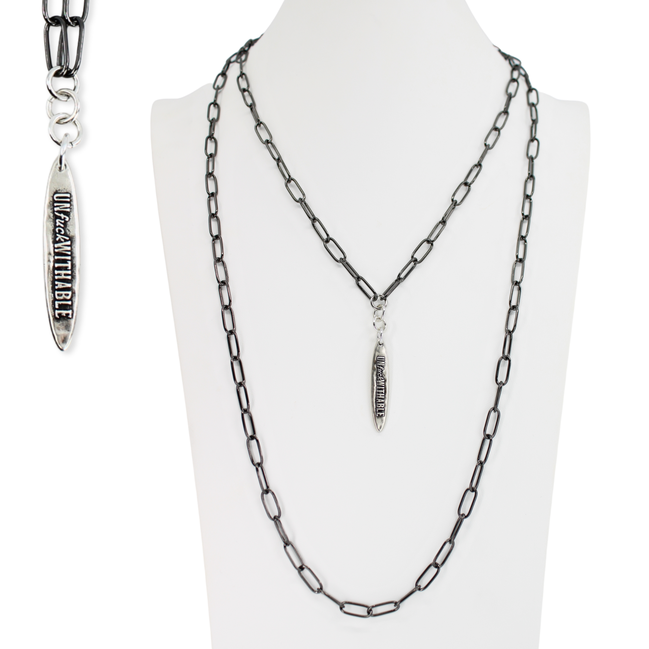Chain necklace with pendant on a mannequin against a white background