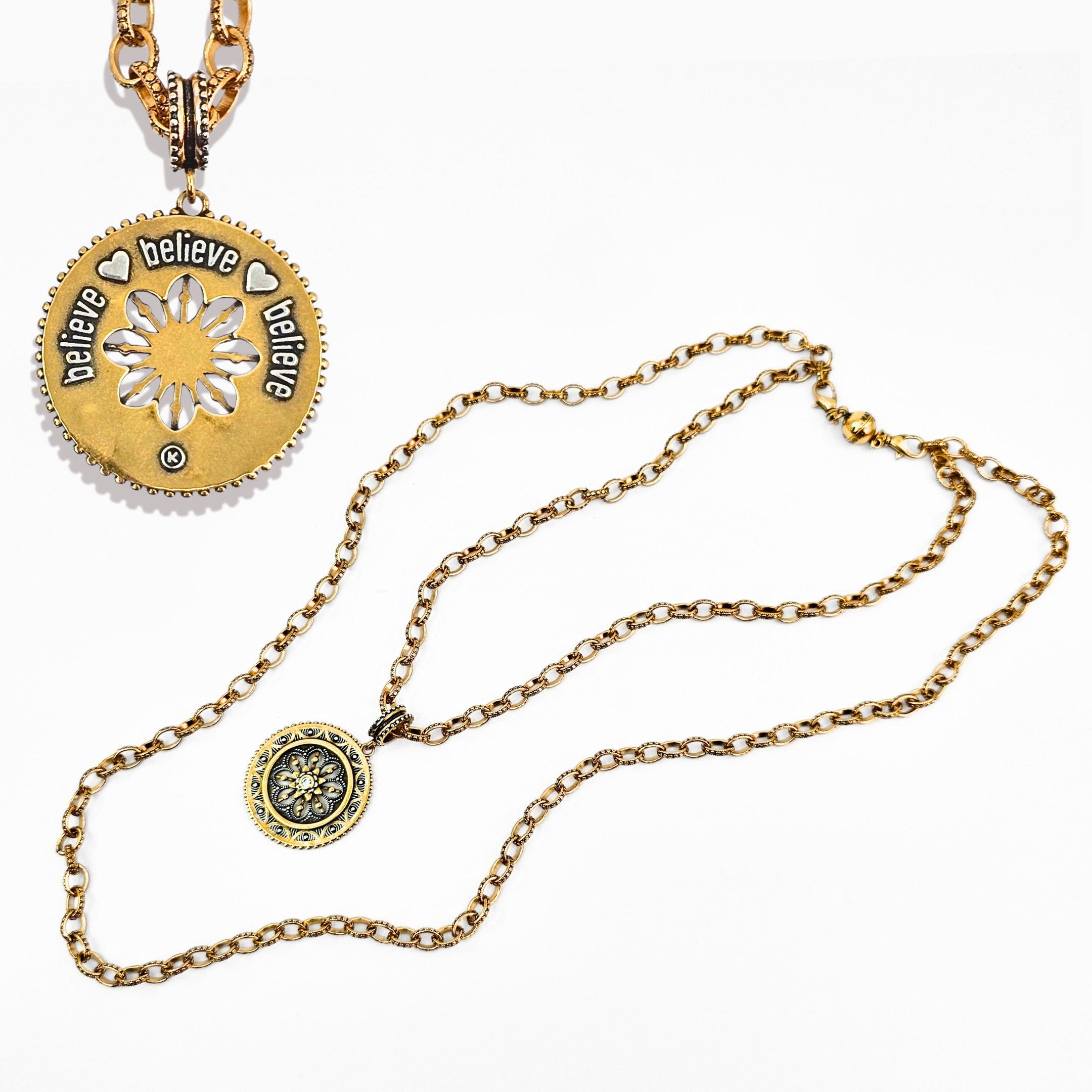 Gold necklace with a pendant featuring 'believe' text on a white background