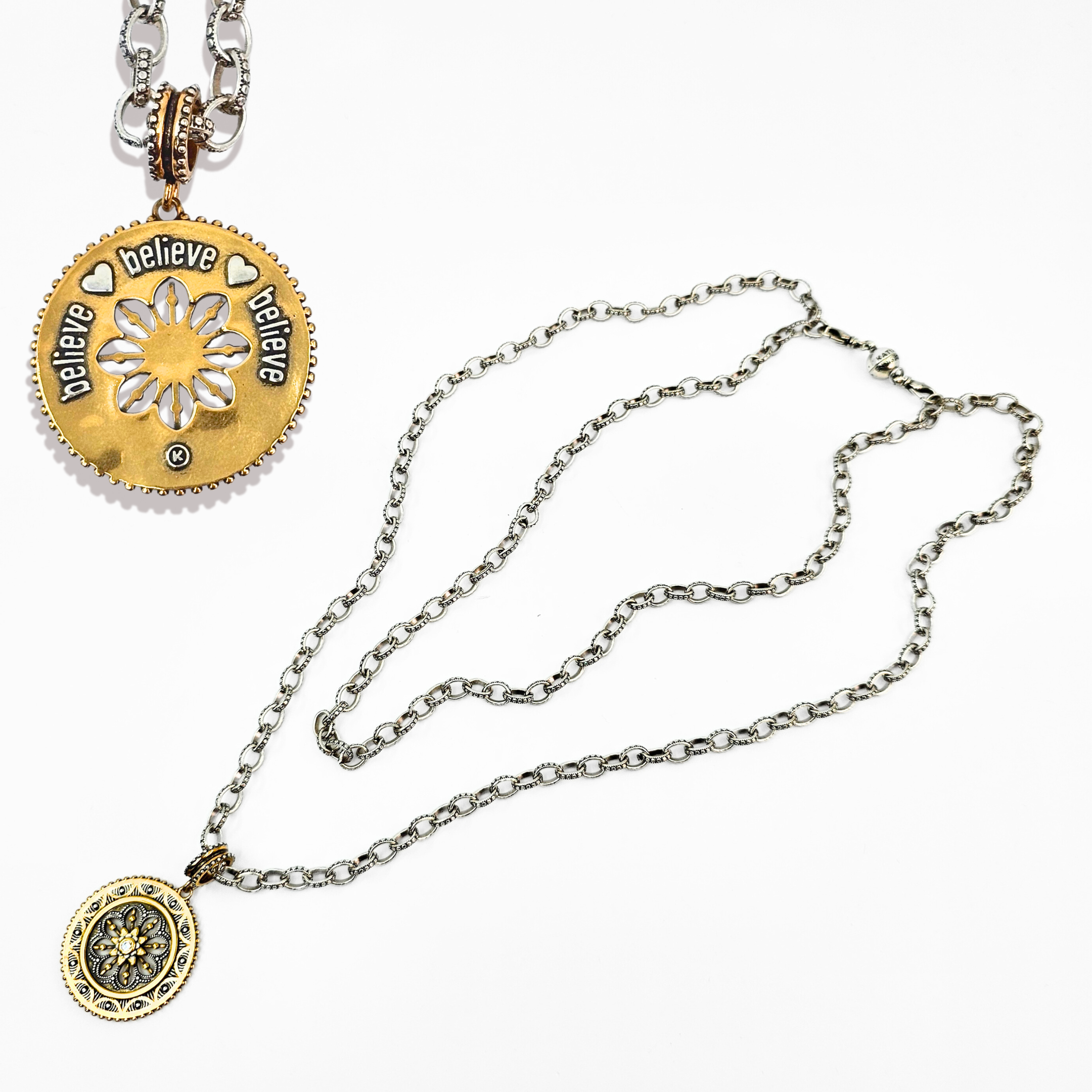 Necklace with gold and silver pendants on a white background