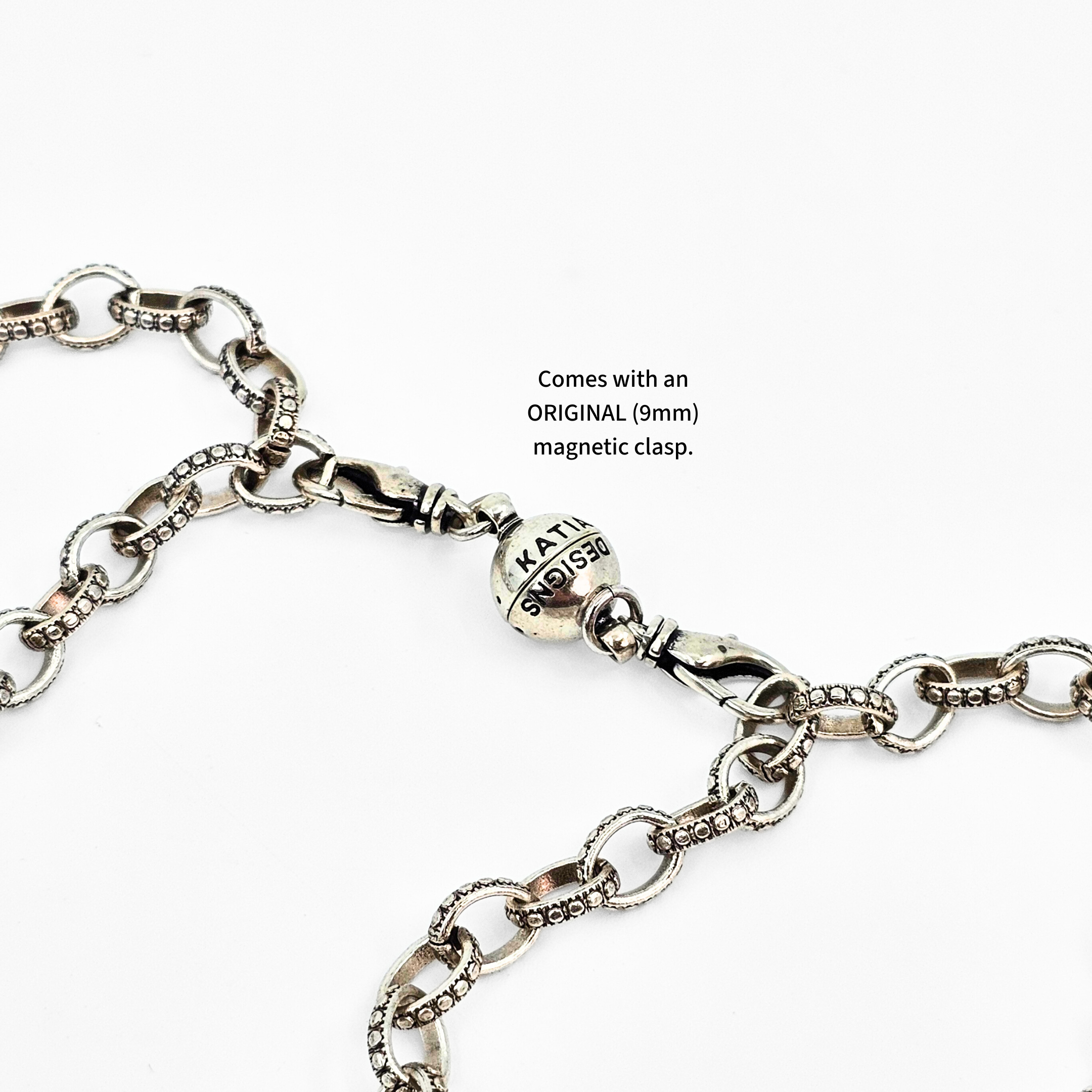 Silver chain bracelet with a clasp on a white background