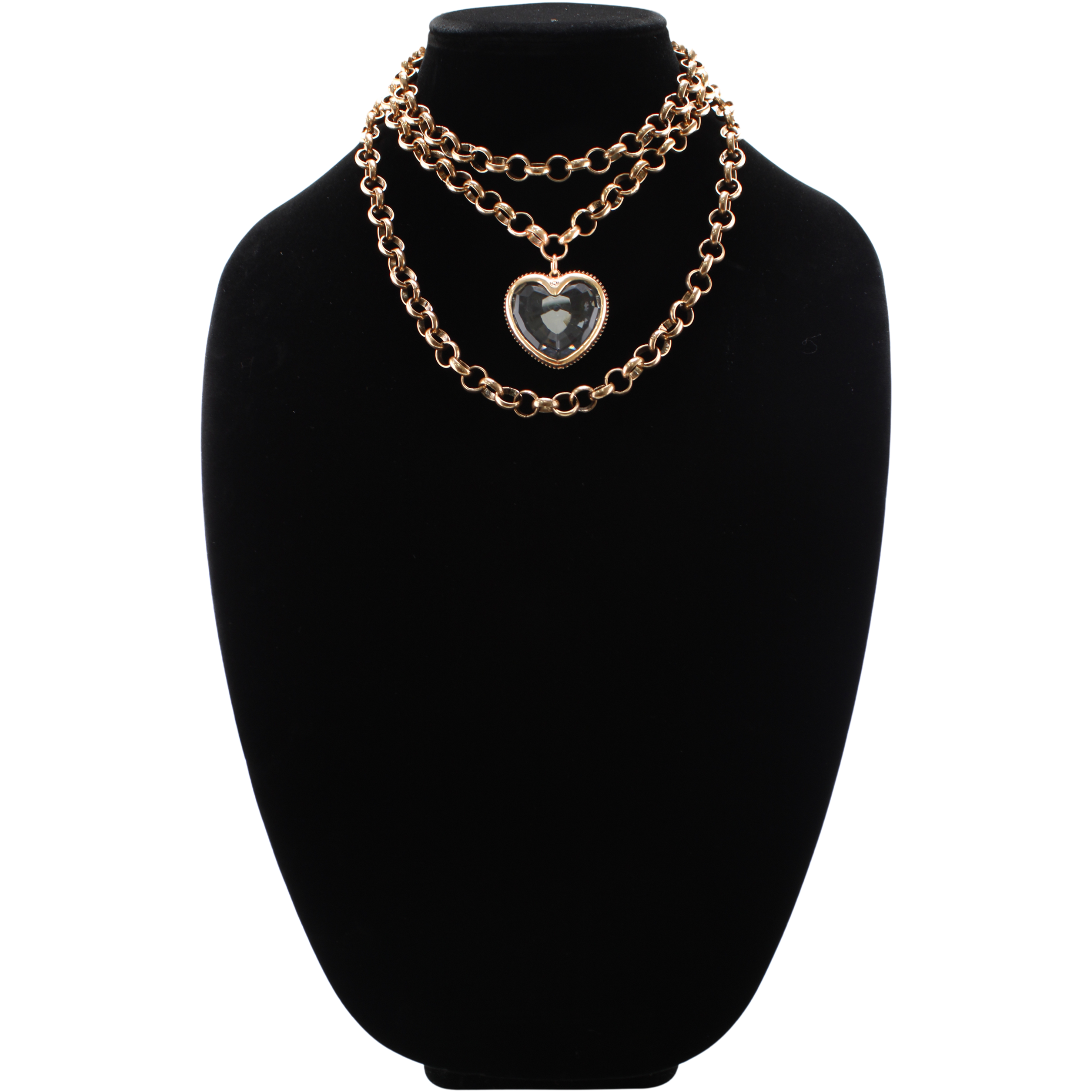 Gold chain necklace with a heart-shaped pendant on a black stand