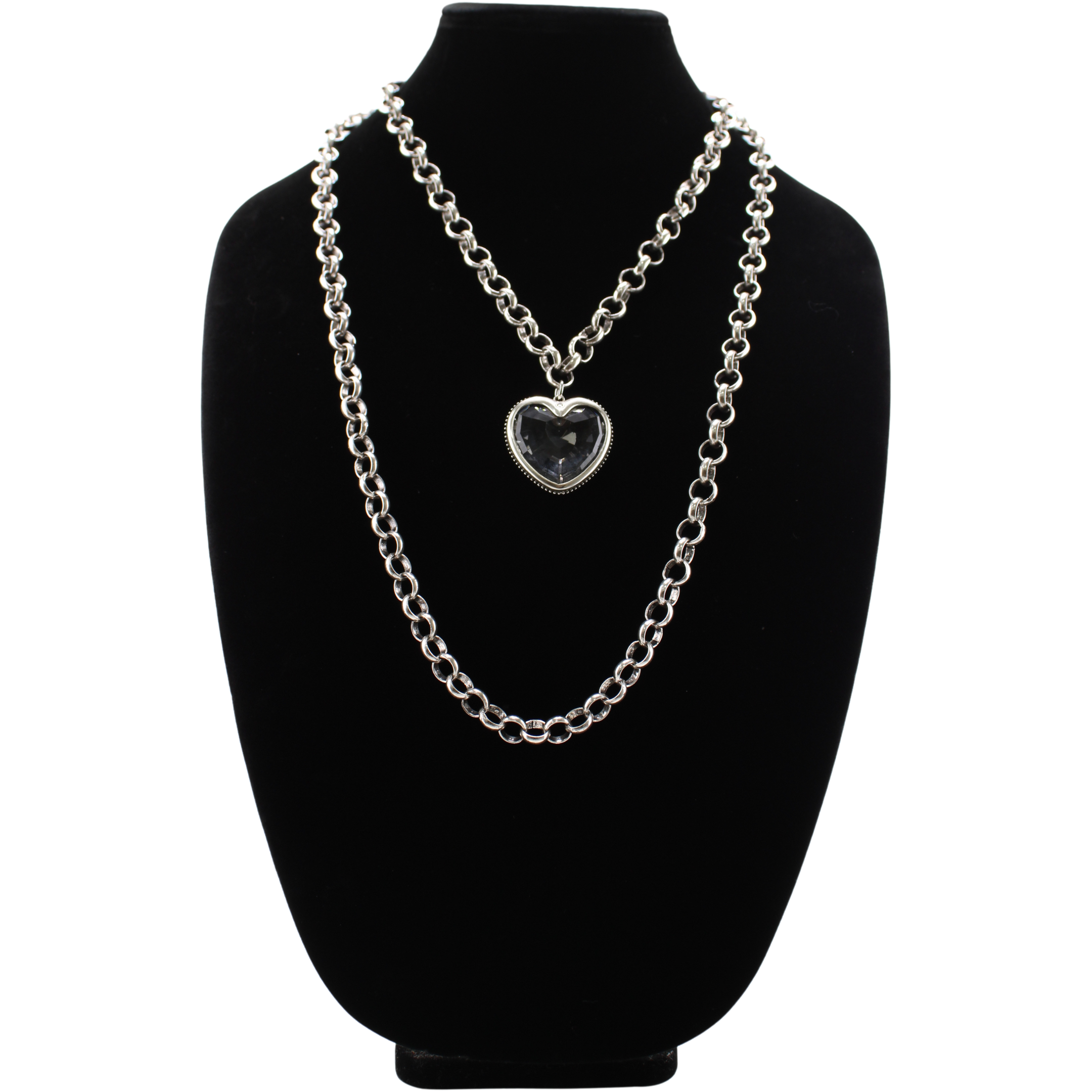 Silver chain necklace with a heart-shaped pendant on a black bust