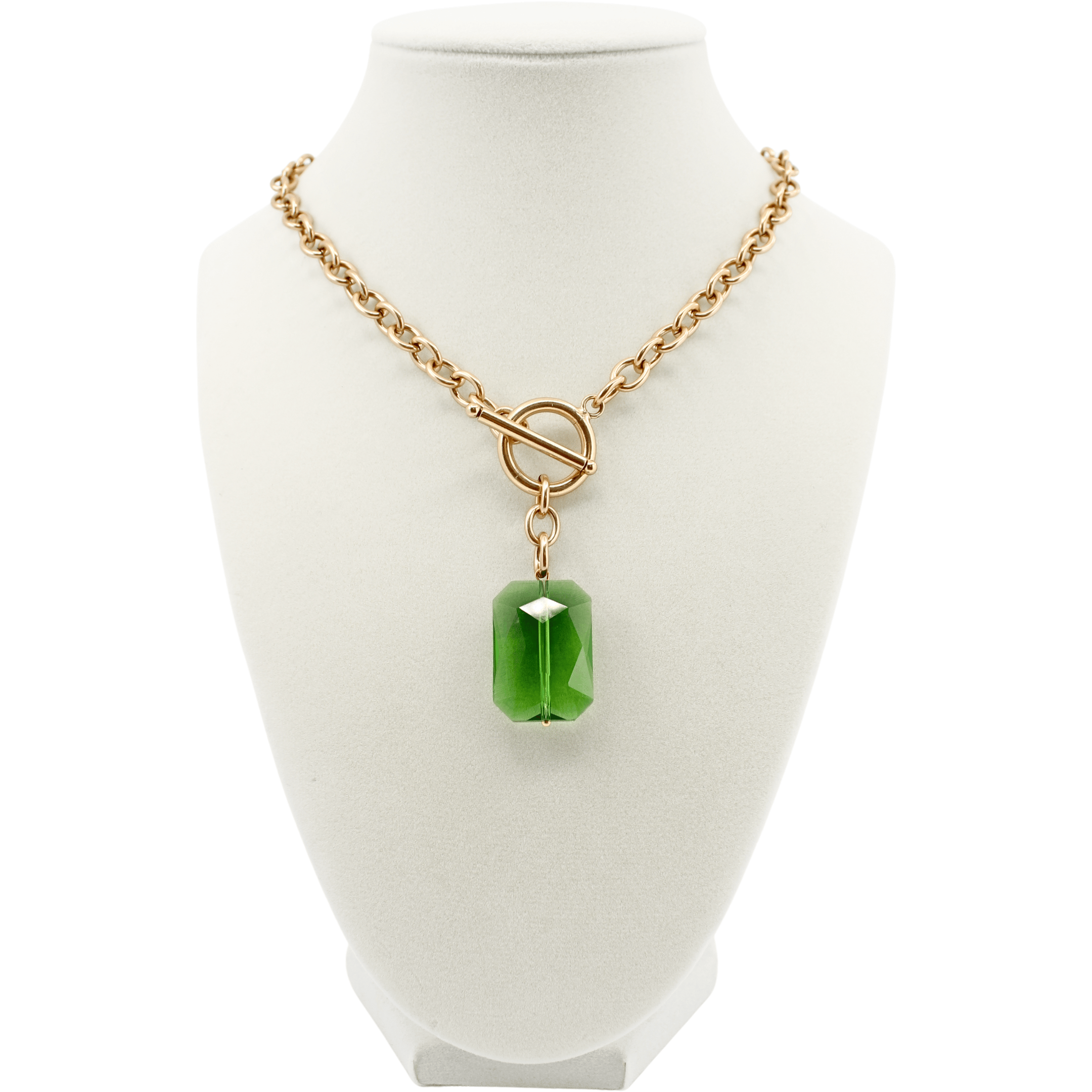Necklace with a green pendant on a white mannequin bust