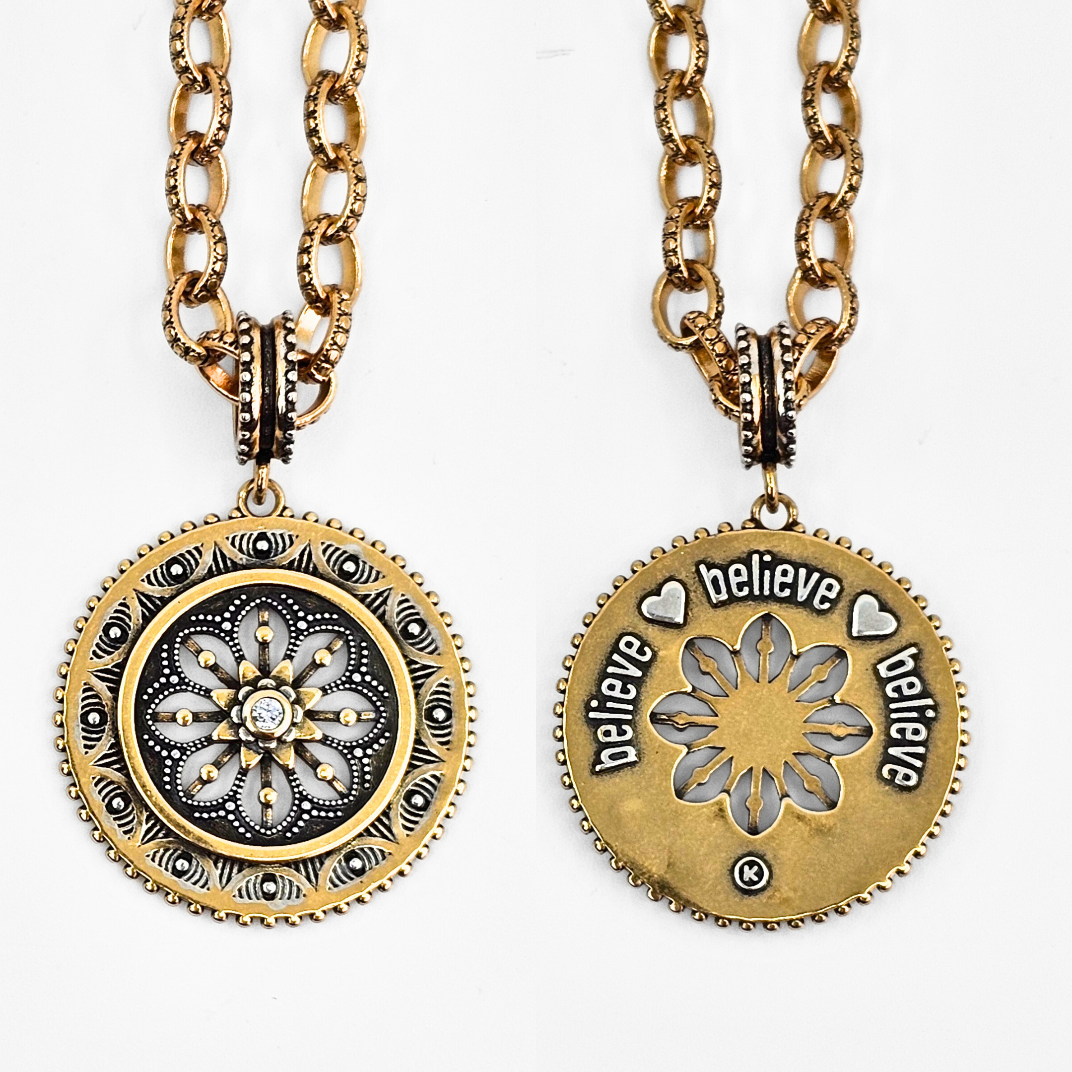 Two gold necklaces with circular pendants on a white background
