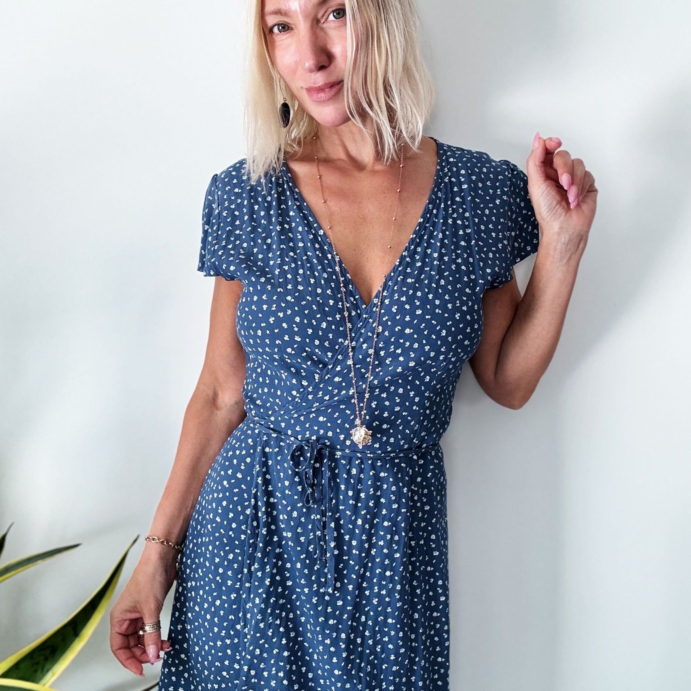 dragonfly pendant detail in gold and silver with message on back reads "all is well"