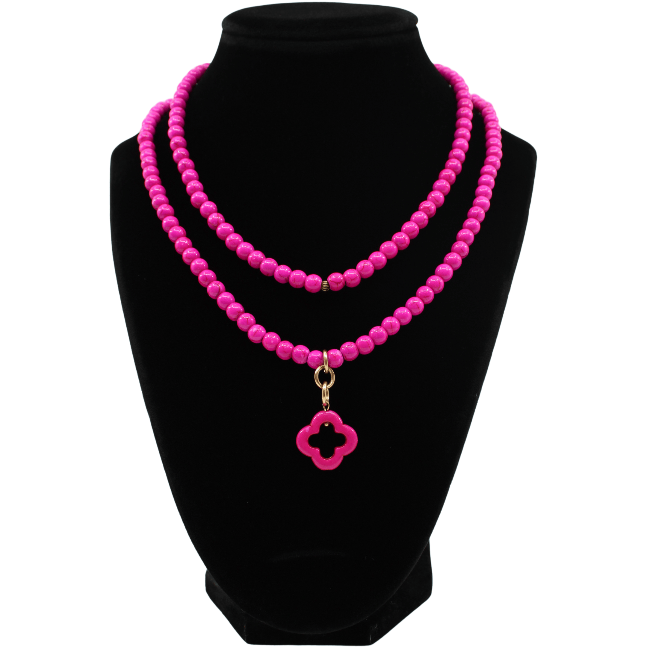multiple colorful beaded boho wrap bracelets in 4 bright colors made with howlite beads. this image shows the pink one on a black bust worn as a necklace