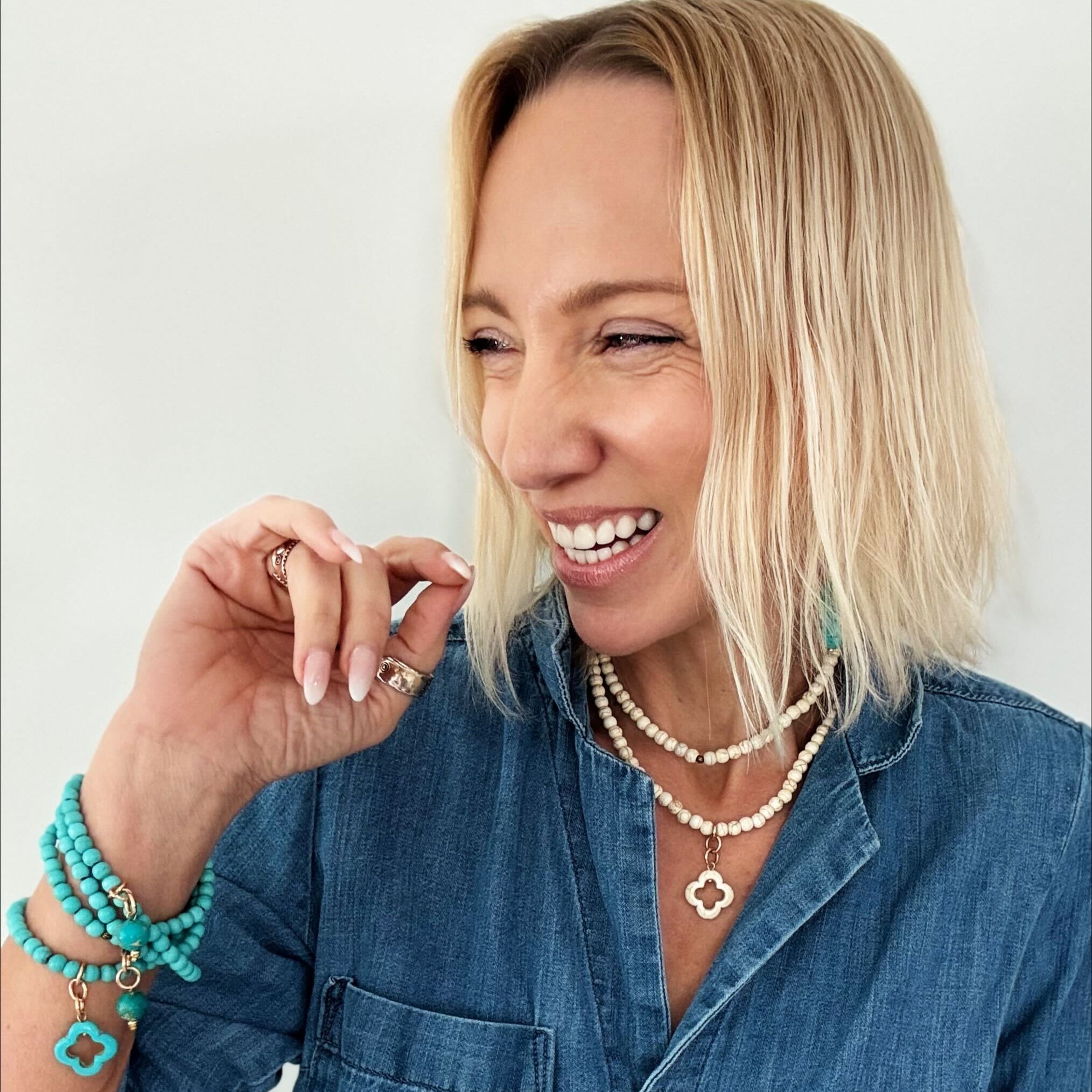 katia wearing blue as bracelet and off-white as necklace