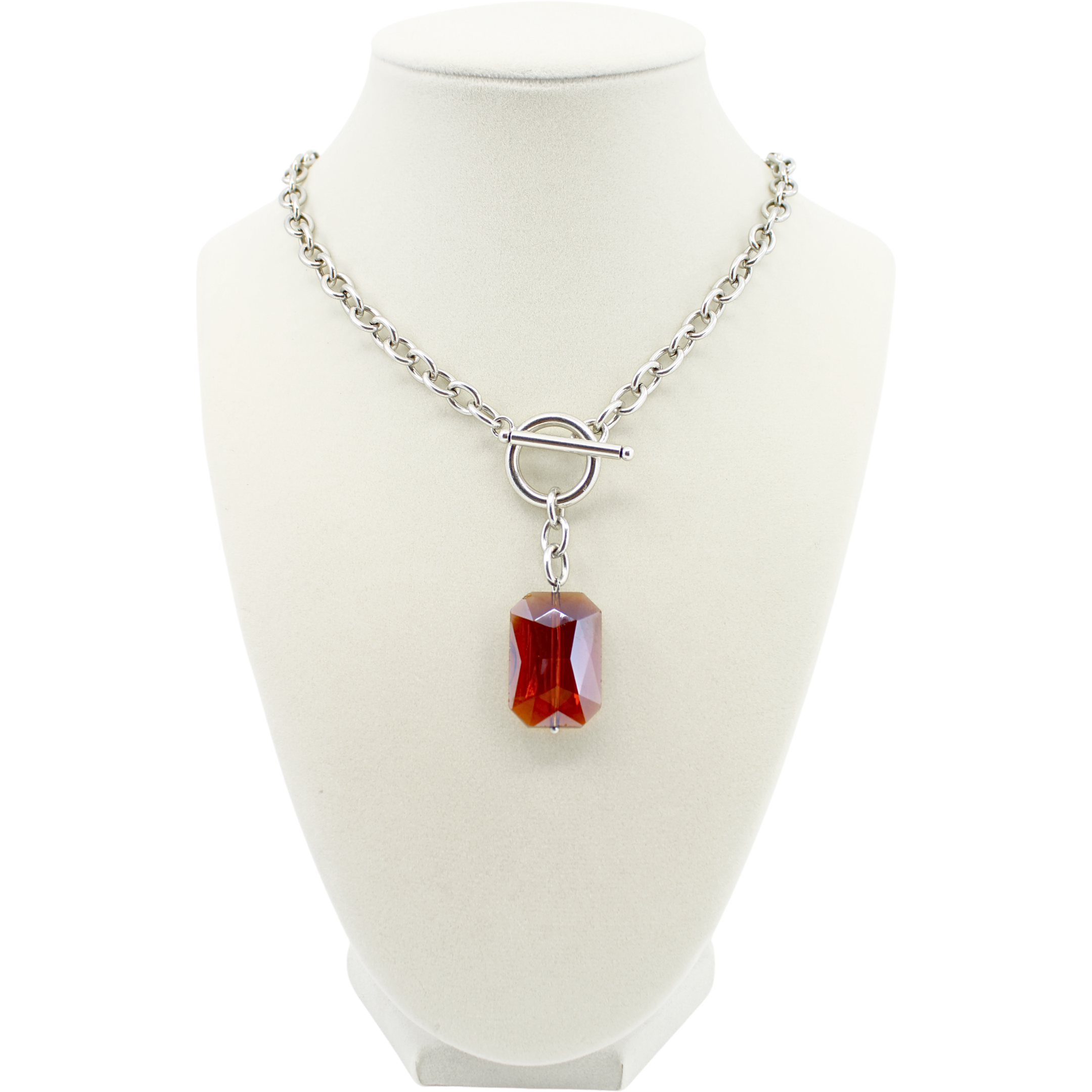 Necklace with a red pendant on a white mannequin bust