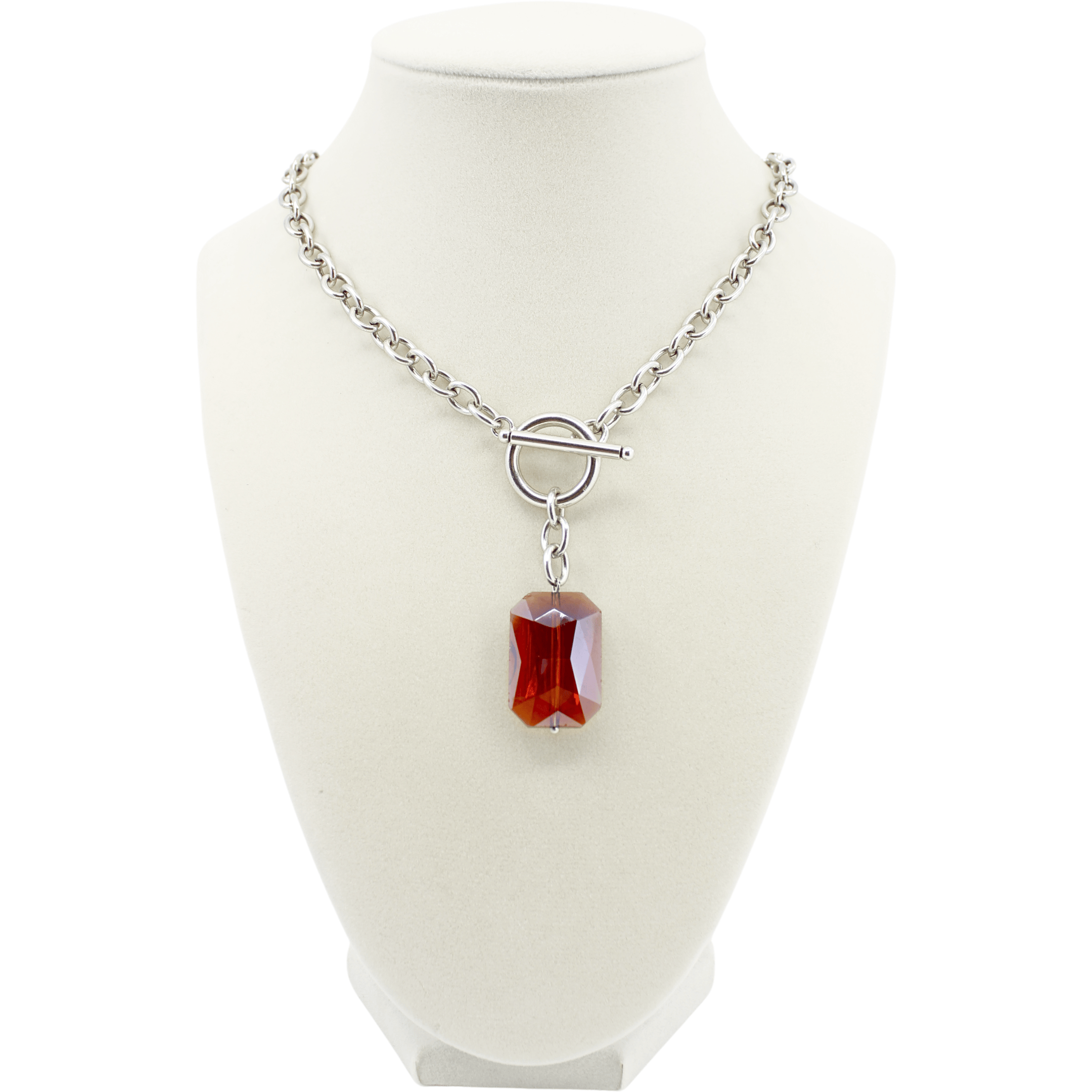 Necklace with a red pendant on a white mannequin bust