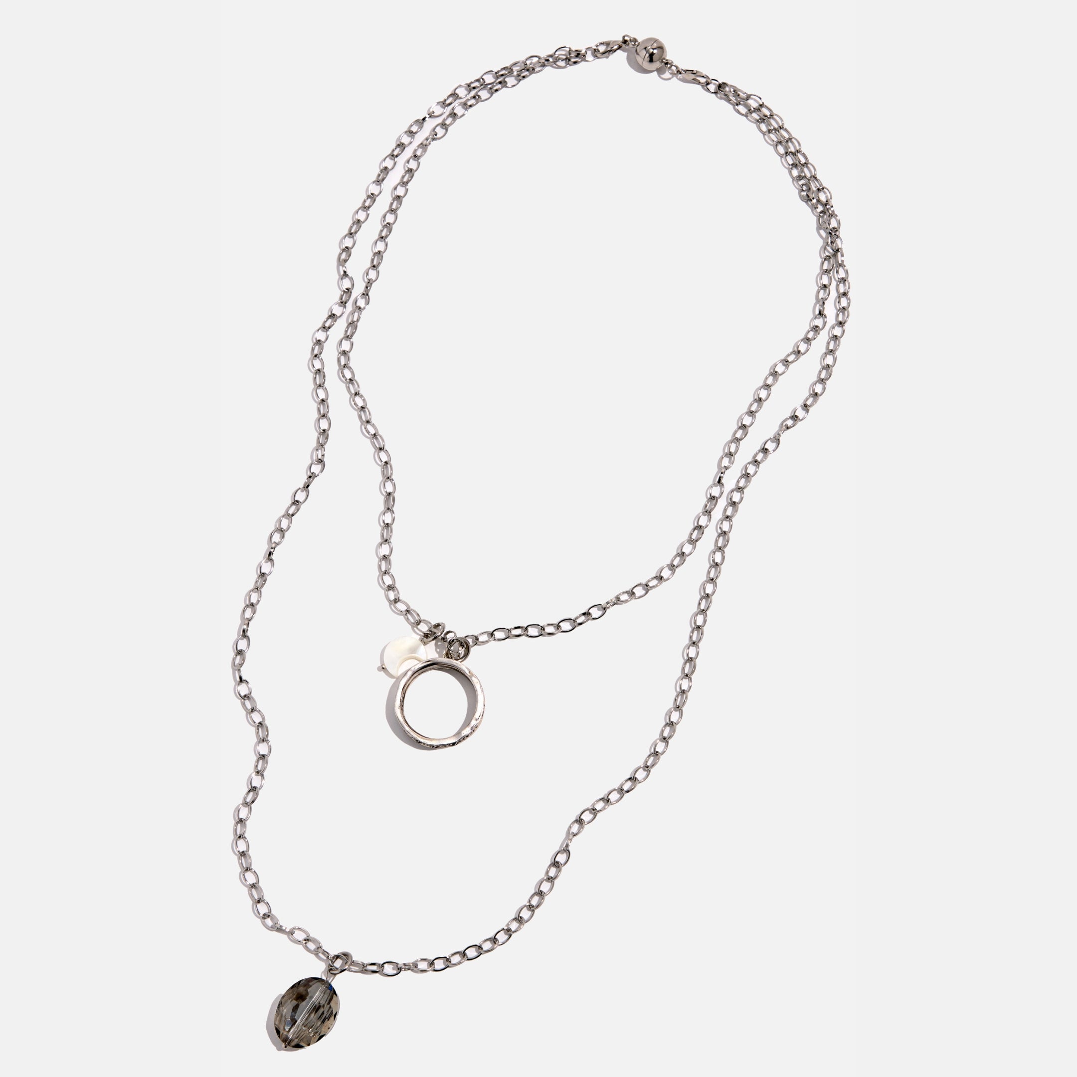 Silver necklace with pendant on a white background