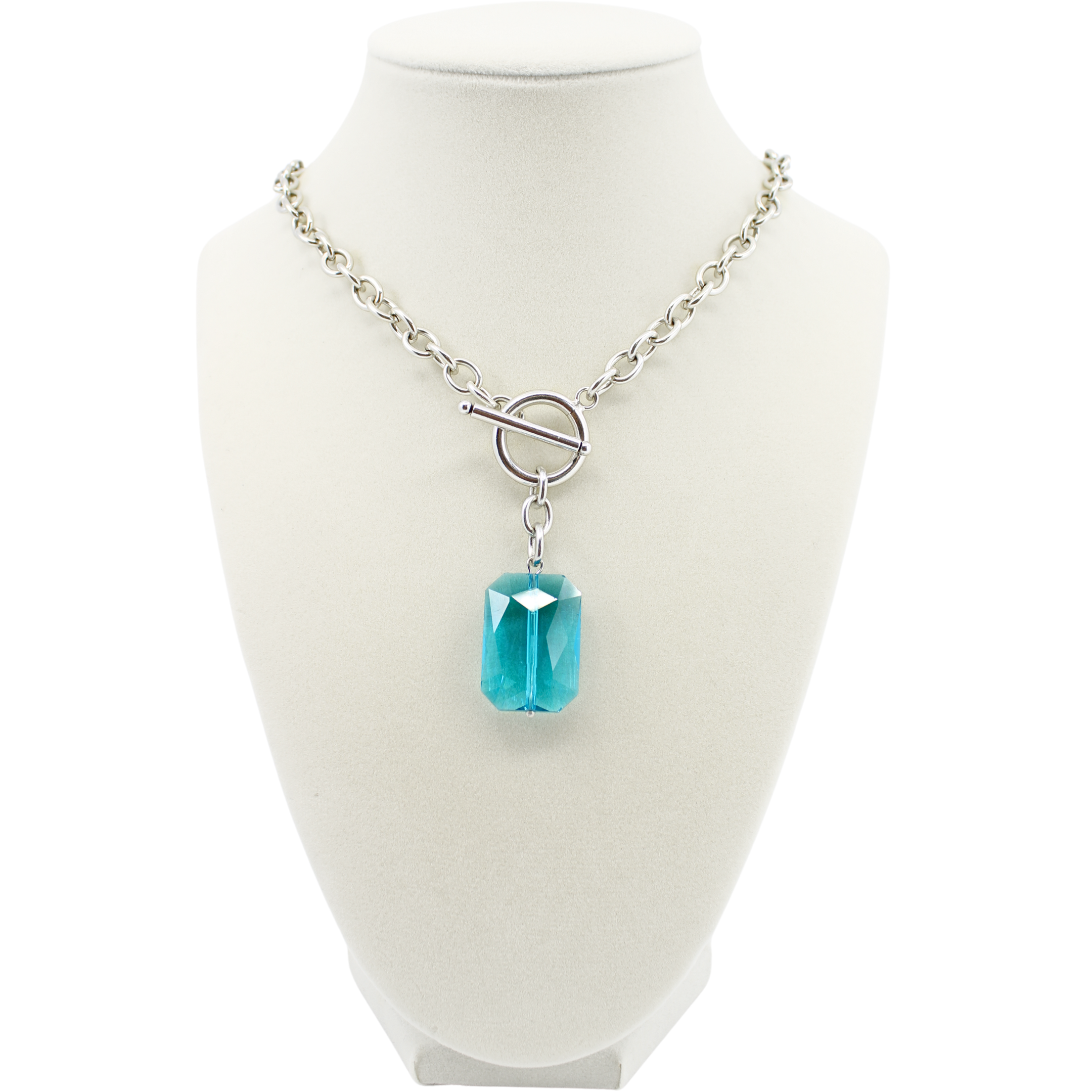 Necklace with a blue pendant on a mannequin bust against a white background