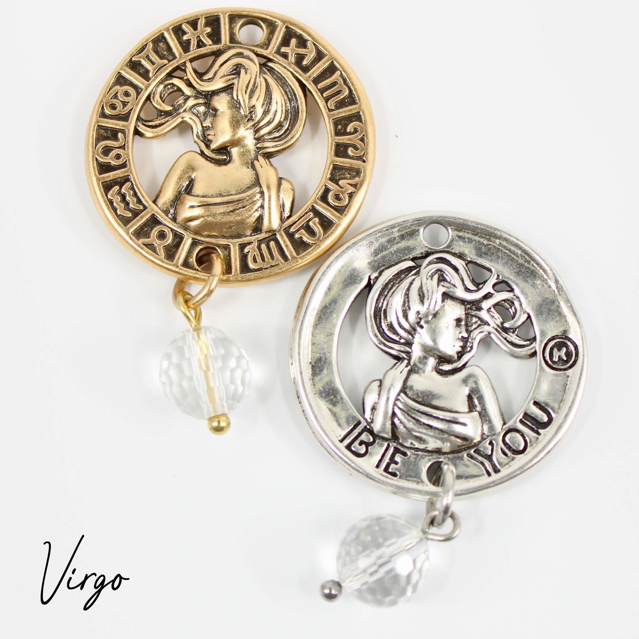 Two necklaces with gold and silver chains, featuring circular pendants with zodiac signs, and faceted crystal quartz accents.