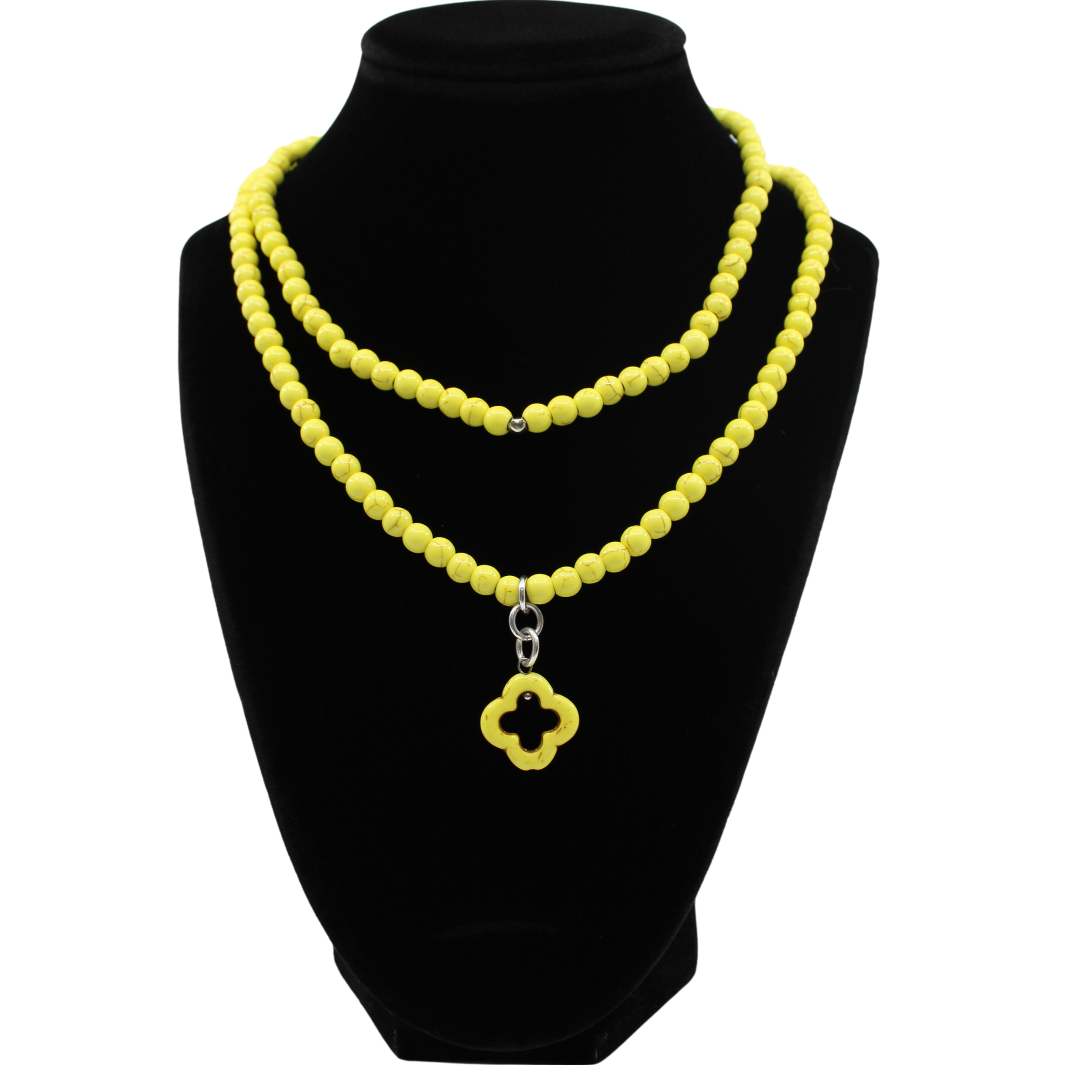 multiple colorful beaded boho wrap bracelets in 4 bright colors made with howlite beads. this image shows the yellow one on a black bust worn as a necklace