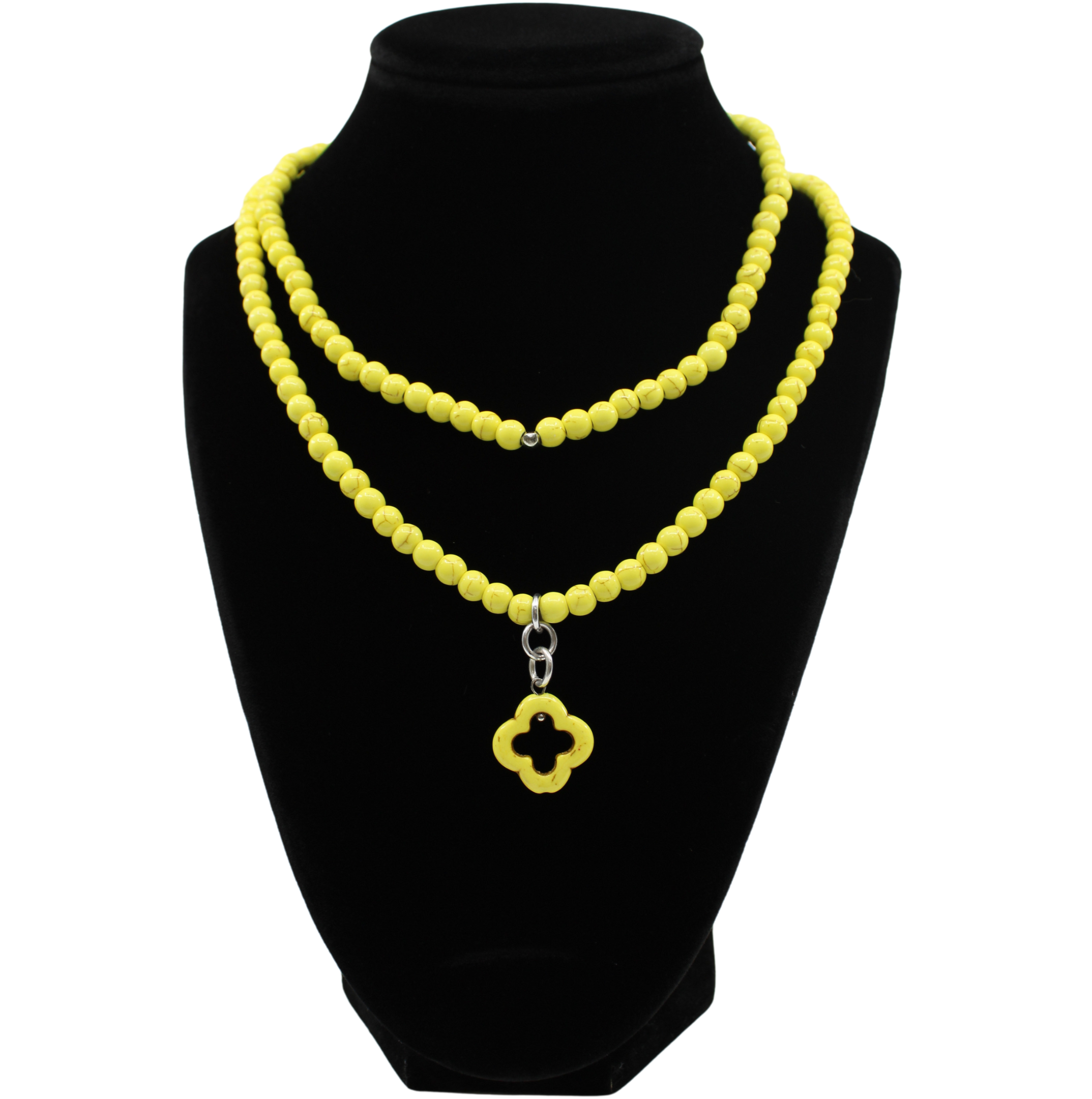 multiple colorful beaded boho wrap bracelets in 4 bright colors made with howlite beads. this image shows the yellow one on a black bust worn as a necklace