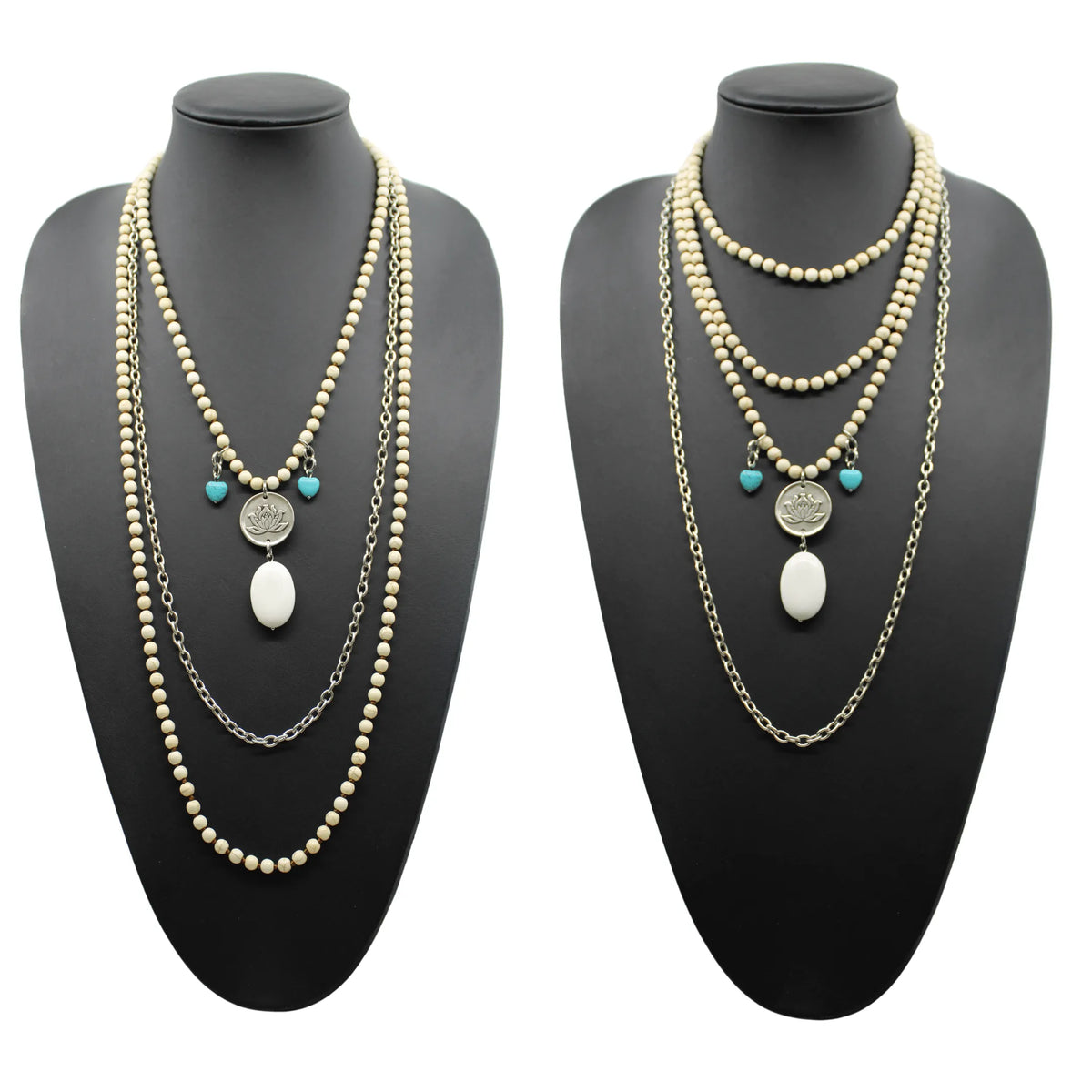 A person wearing a black shirt and showcasing a long gold chain necklace with off-white and blue howlite stones, along with matching bracelets and earrings.