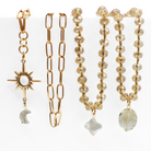 Set of gold and beaded jewelry on a white background