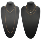 Two layering chain necklaces, one in gold finish and one in silver, each with pearl accent stones.