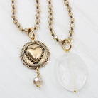 Alt Text: A collection of beaded necklaces with crystal elements, available in gold or silver finish, some with a 'I Am Enough' inscription.