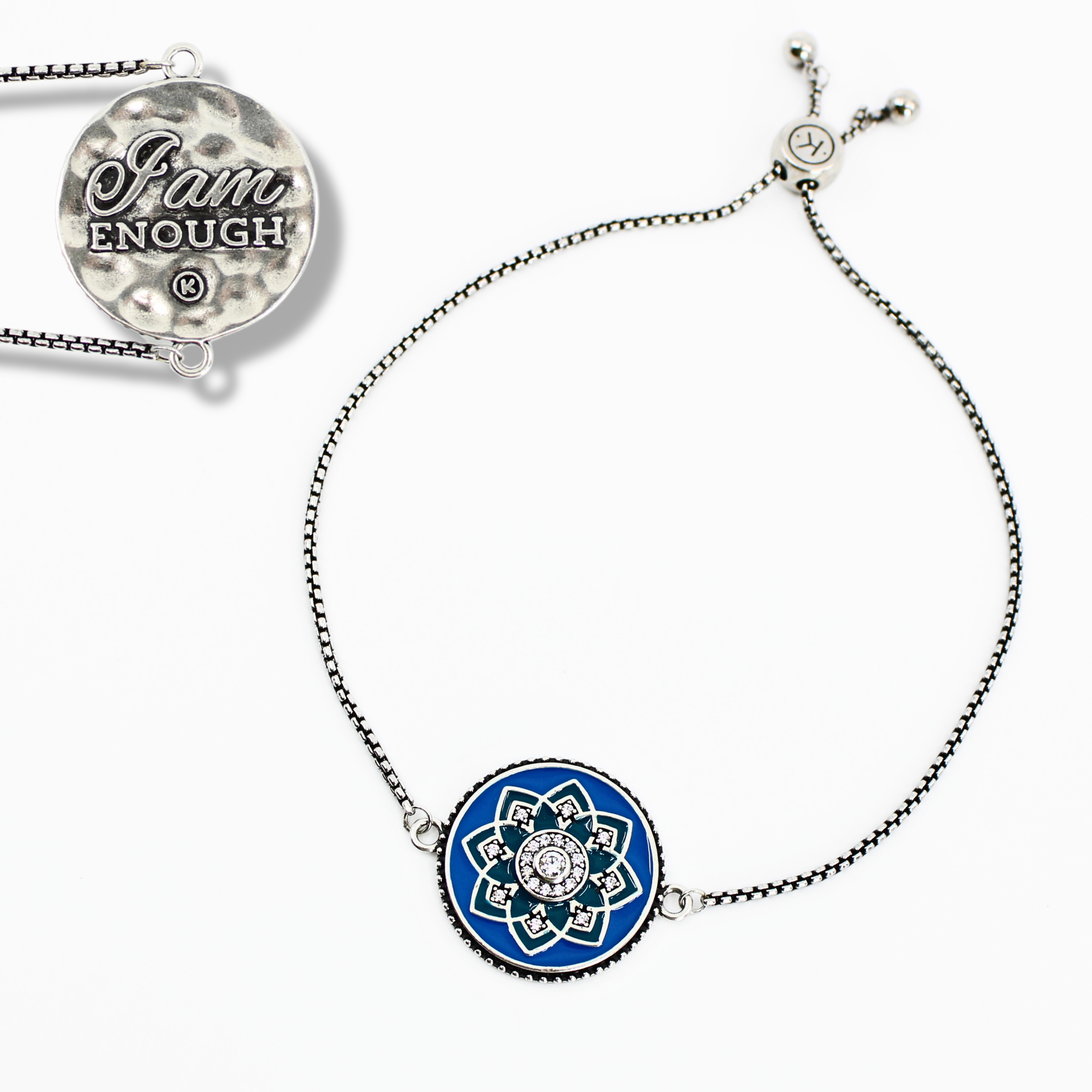 Bracelet with blue circular charm and 'I am Enough' pendant on a white background