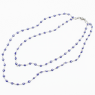 Necklace with blue and white beads on a white background