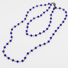 Necklace with blue beads on a white background