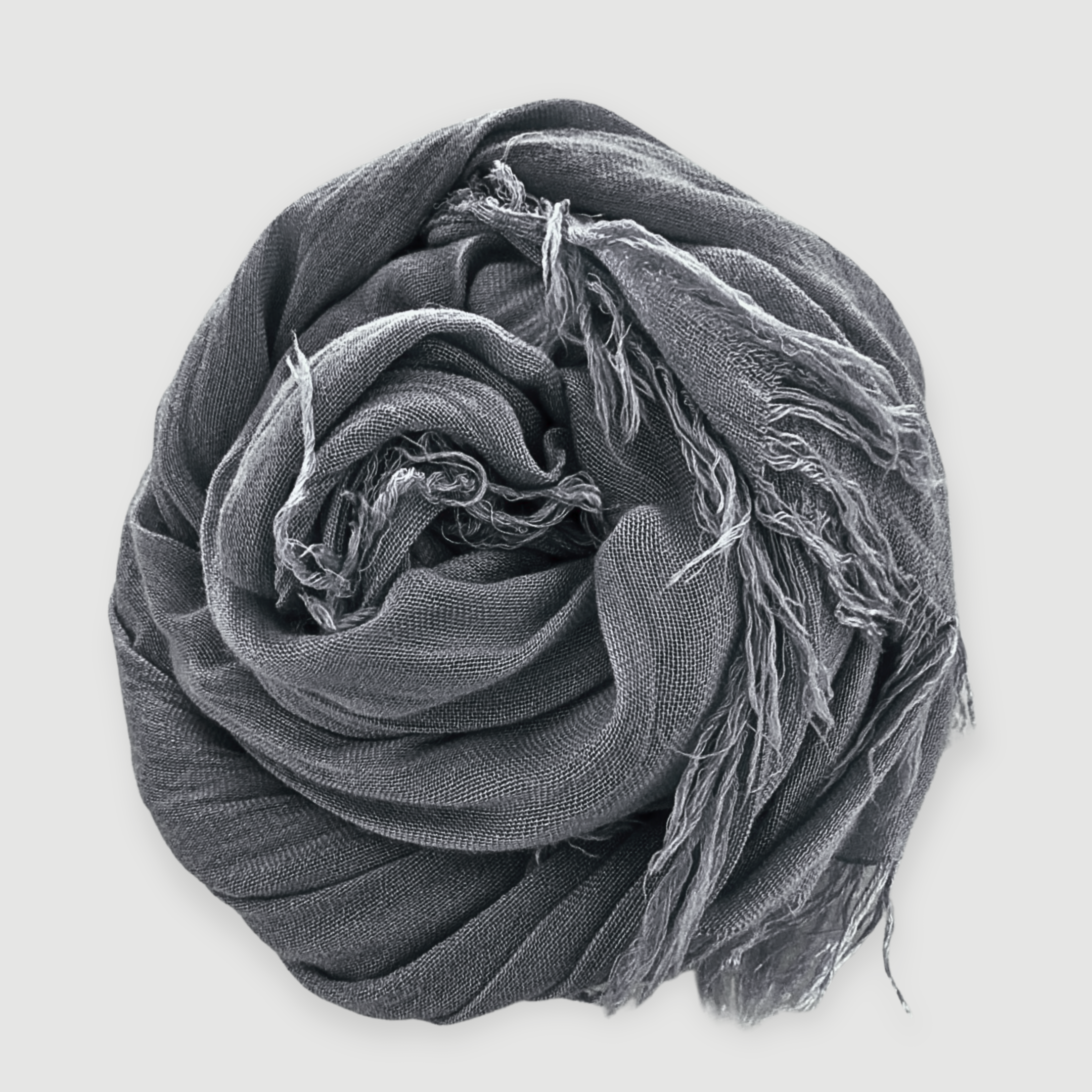 Gray scarf with tassels on a light gray background