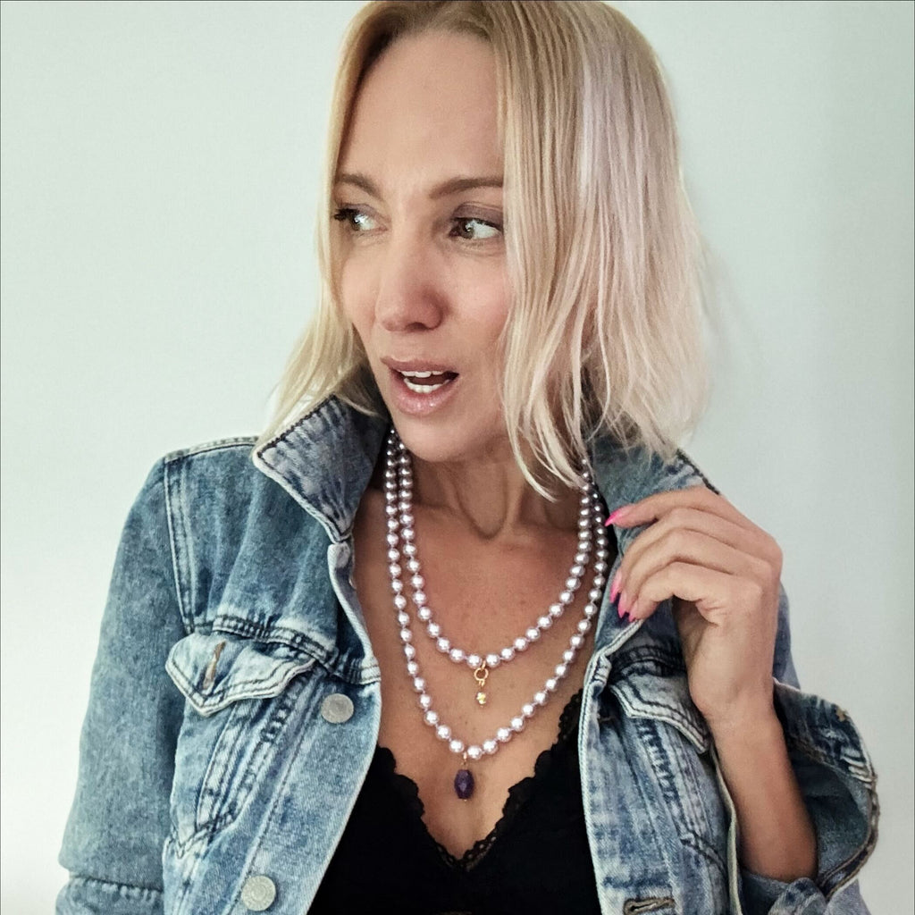 KATIA WEARING LILAC layering pearl necklace;
Strings of LILAC pearls with DOGTOOTH AMETHYSTAND FACETED CLEAR AB CRYSTAL