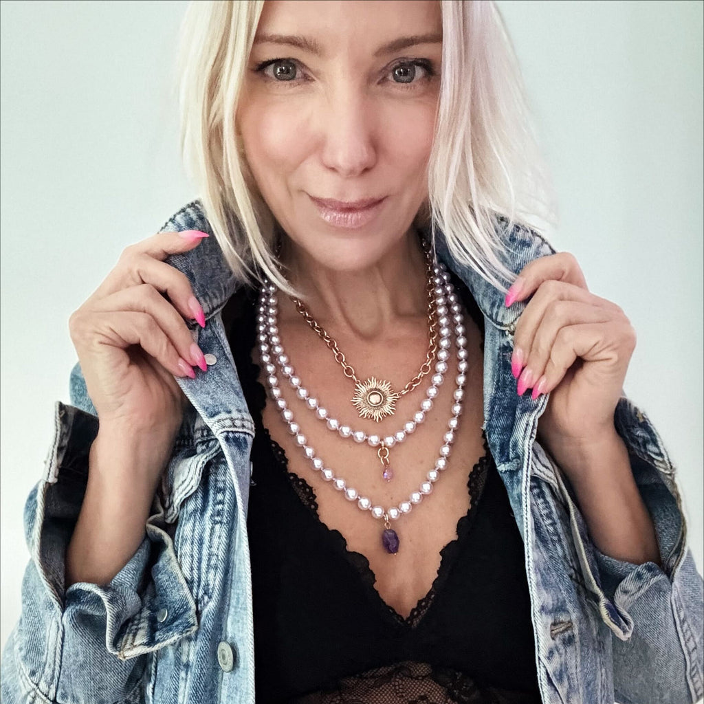 LILAC layering pearl necklace;
Strings of LILAC pearls with DOGTOOTH AMETHYSTAND FACETED CLEAR AB CRYSTAL PICTURED ON KATIA WITH MIDI CHOKER IN GOLD