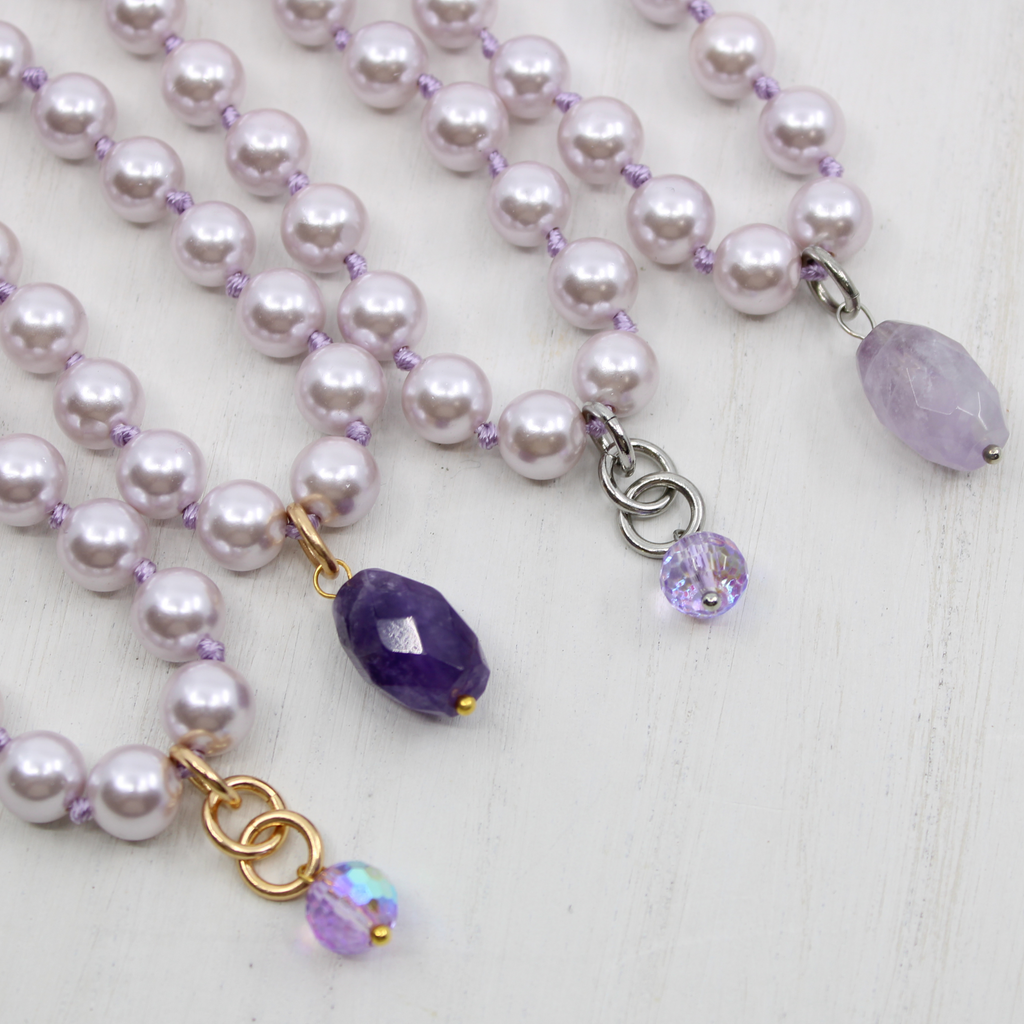 LILAC layering pearl necklace;
Strings of LILAC pearls with DOGTOOTH AMETHYSTAND FACETED CLEAR AB CRYSTAL