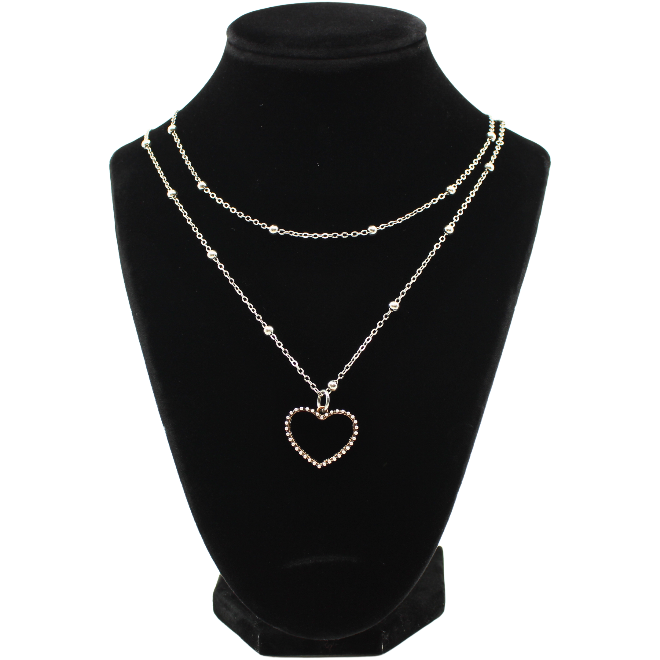 A jewelry display features a black velvet bust showcasing a necklace with delicate silver chain. The chain, with a magnetic clasp, displays an open heart pendant adorned with small MIX METAL DETAILS AND TRIM AND INSCRIBED WITH love always INSIDE.