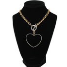 love always open heart mix metal statement choker necklace from katia designs. statement choker necklace adorned with a large hollow heart pendant, showcasing a two-tone design embellished trim and a heartfelt inscription. gold product variant pictured on display on velvet bust.