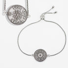 Silver necklace and bracelet set with circular medallions on a white background