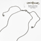 Silver necklace with a dainty magnetic clasp on a white background