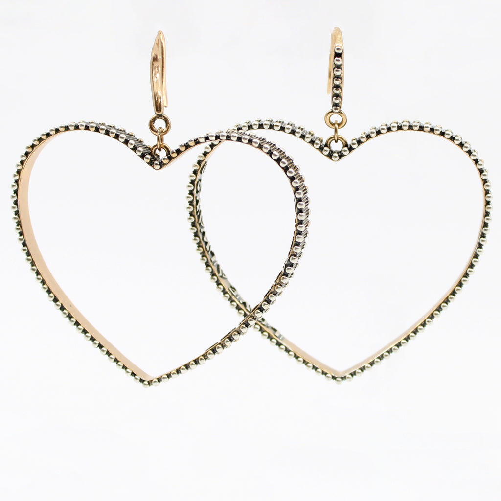 Front shot of open heart drop earrings with mixed metal details