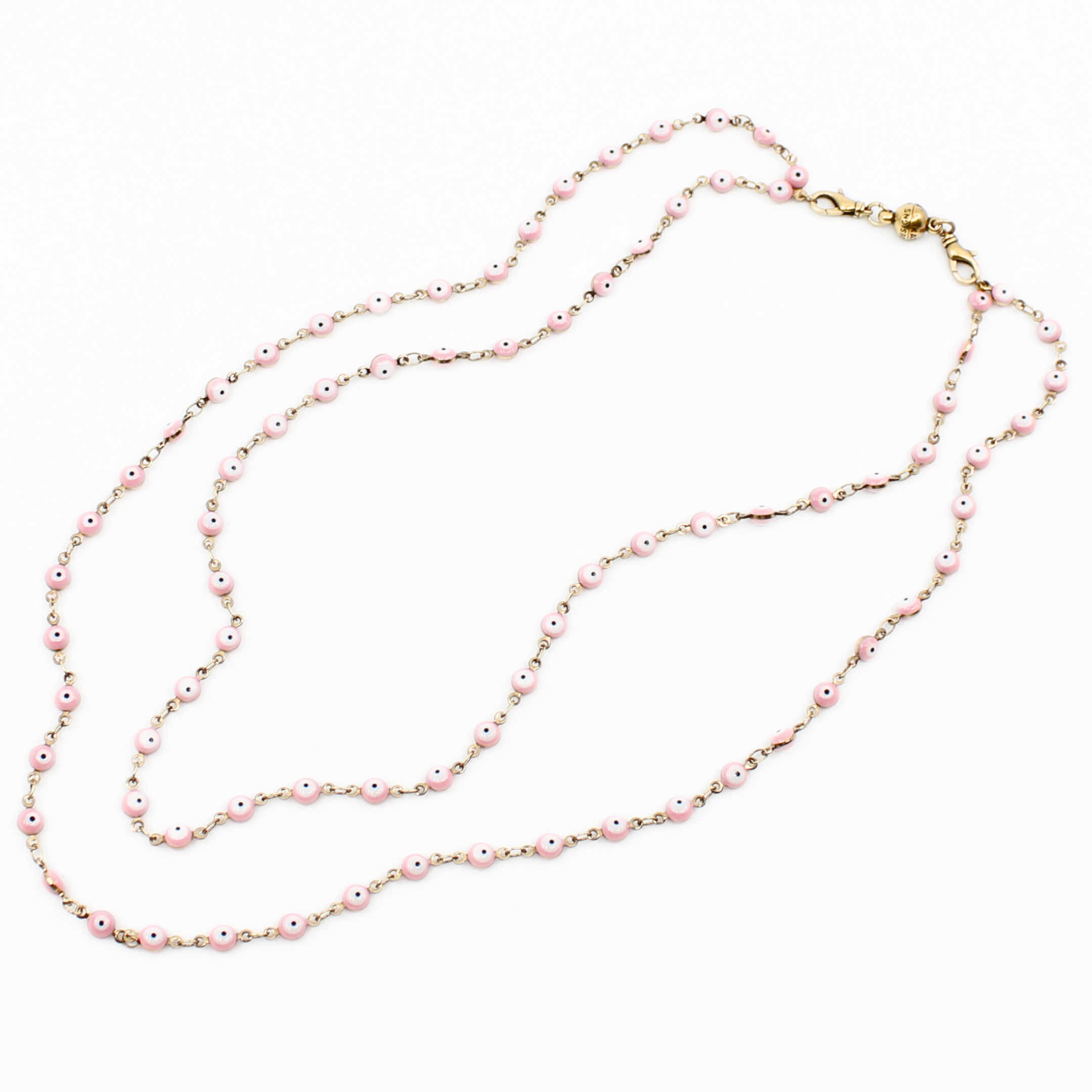 Pink beaded necklace on a white background
