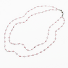 Pink pearl necklace on a white background