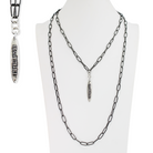 Chain necklace with pendant on a mannequin against a white background